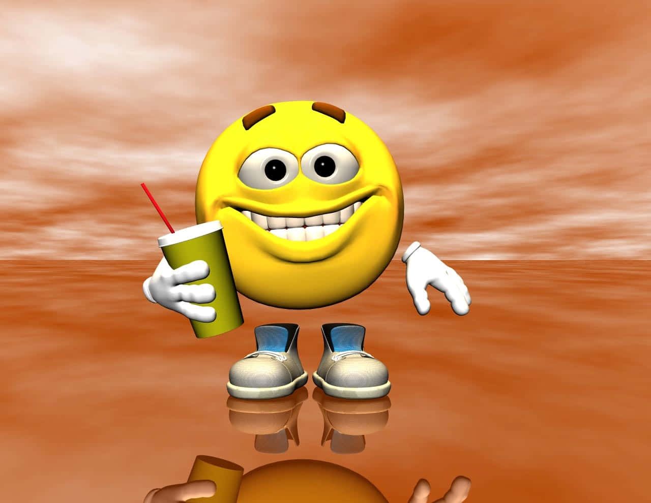Smiley 桌布 壁紙 — 一個開心的黃色3D渲染表情符號角色，有手腳和鞋子，在溫暖的橙色漸變背景前拿著一個綠色飲料杯。