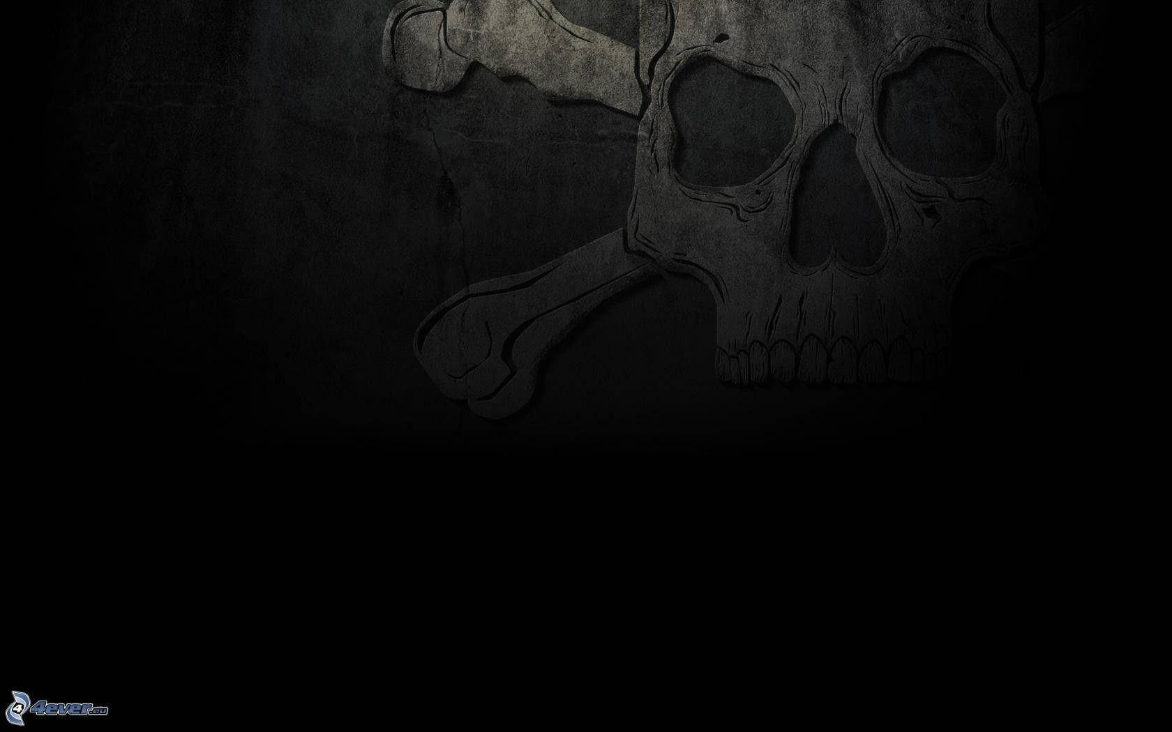 Black Skull 桌布 壁紙 — 一個陰森的骷髏頭和交叉骨頭刻在深色紋理牆壁上，帶有深沉的陰影。