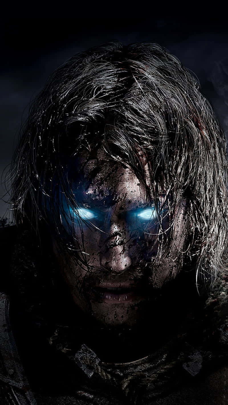 Shadow Of Mordor 桌布 壁紙 — 一個陰沉的戰士，擁有發光的藍色眼睛和濕漉漉的黑髮，在陰影背景下強烈凝視。