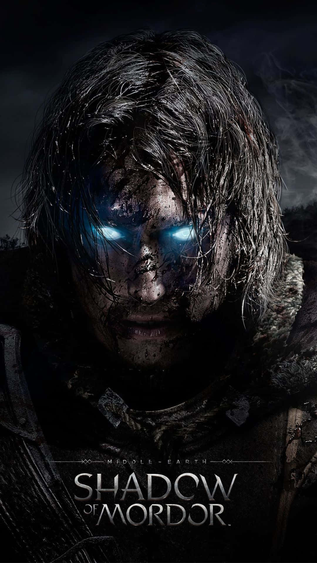 Android Shadow Of Mordor 桌布 壁紙 — 一個陰沉的戰士，擁有發光的藍色眼睛和凌亂的深色頭髮，在陰影背景下強烈凝視。