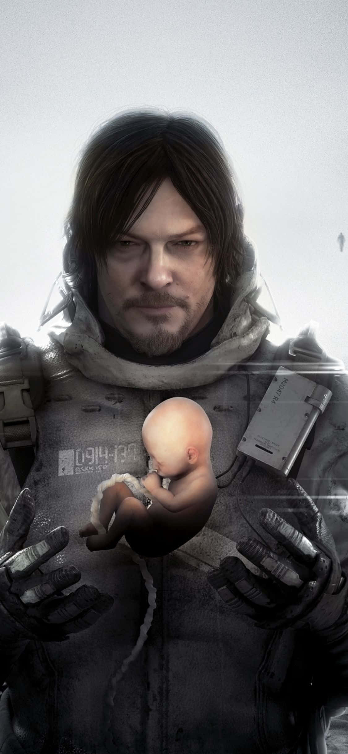 iPhone Xs Death Stranding 桌布 壁紙 — 一個陰沉的男人穿著破舊的夾克，在荒涼的雪景背景下抱著一個細小的新生嬰兒。