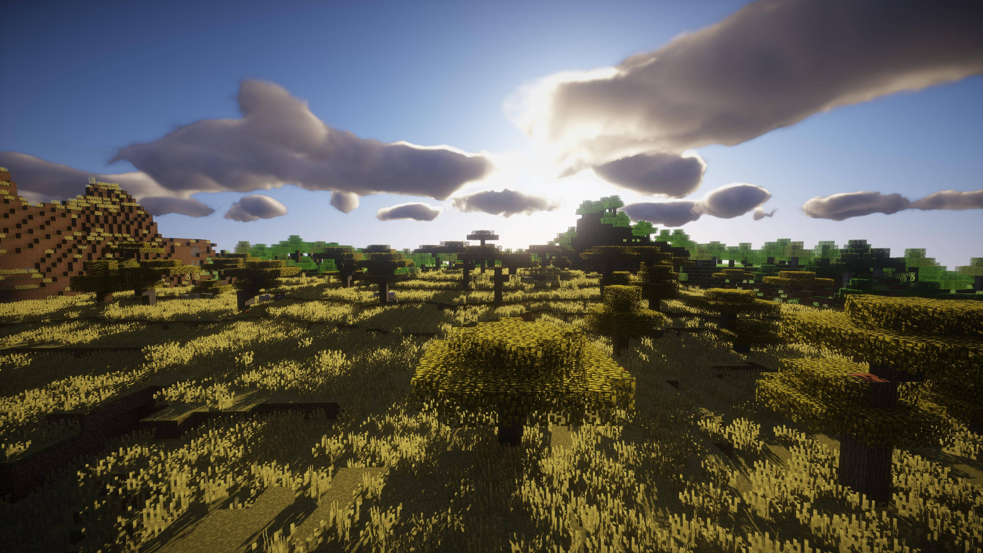 4K Minecraft 壁紙 桌布 壁紙 — 一個陽光明媚的Minecraft景觀，有方塊樹木和草地，天空有蓬鬆的雲。