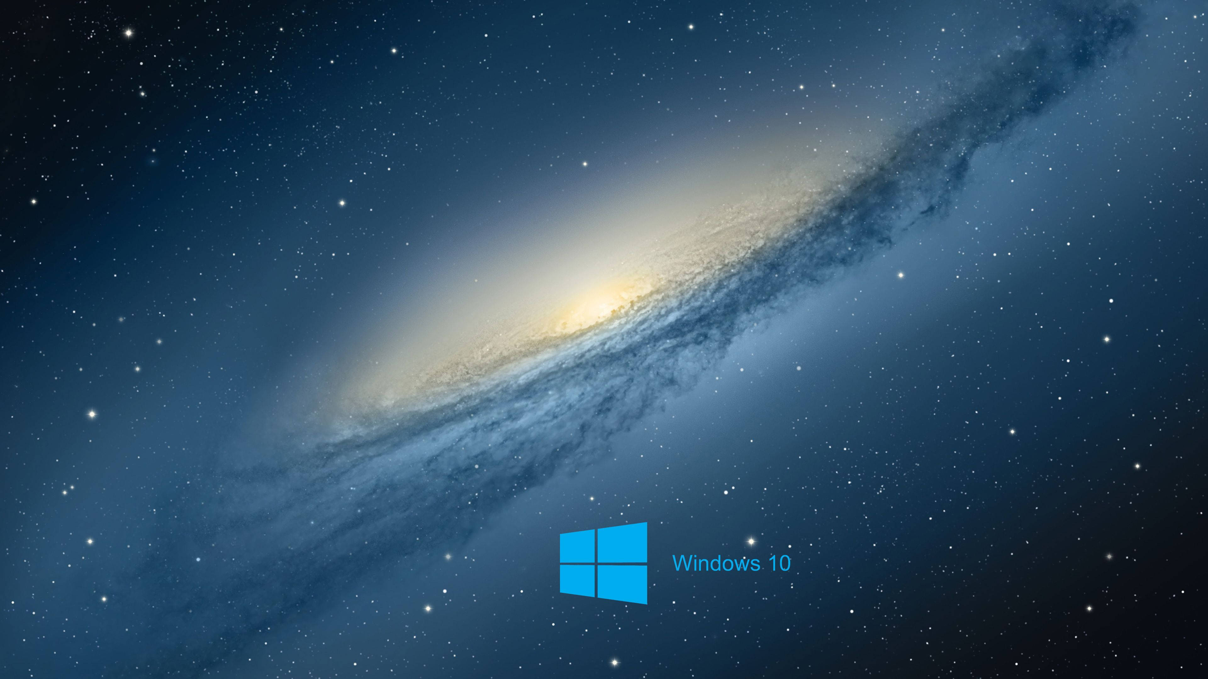 Windows 桌布 壁紙 — 一個雄偉的螺旋星系，帶有發光核心和旋轉的塵埃帶，以星空為背景，並帶有Windows 10標誌。