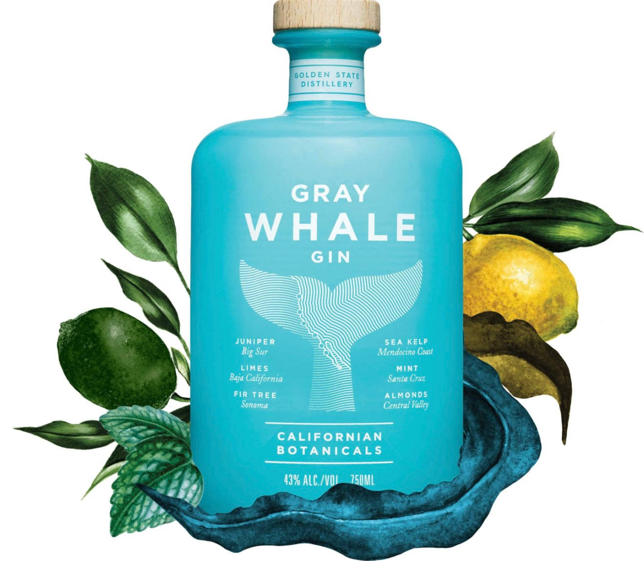 alcohol 桌布 壁紙 — 一個青綠色的Gray Whale Gin酒瓶，周圍是新鮮的萊姆、薄荷和檸檬葉，放在深藍色波浪形底座上。