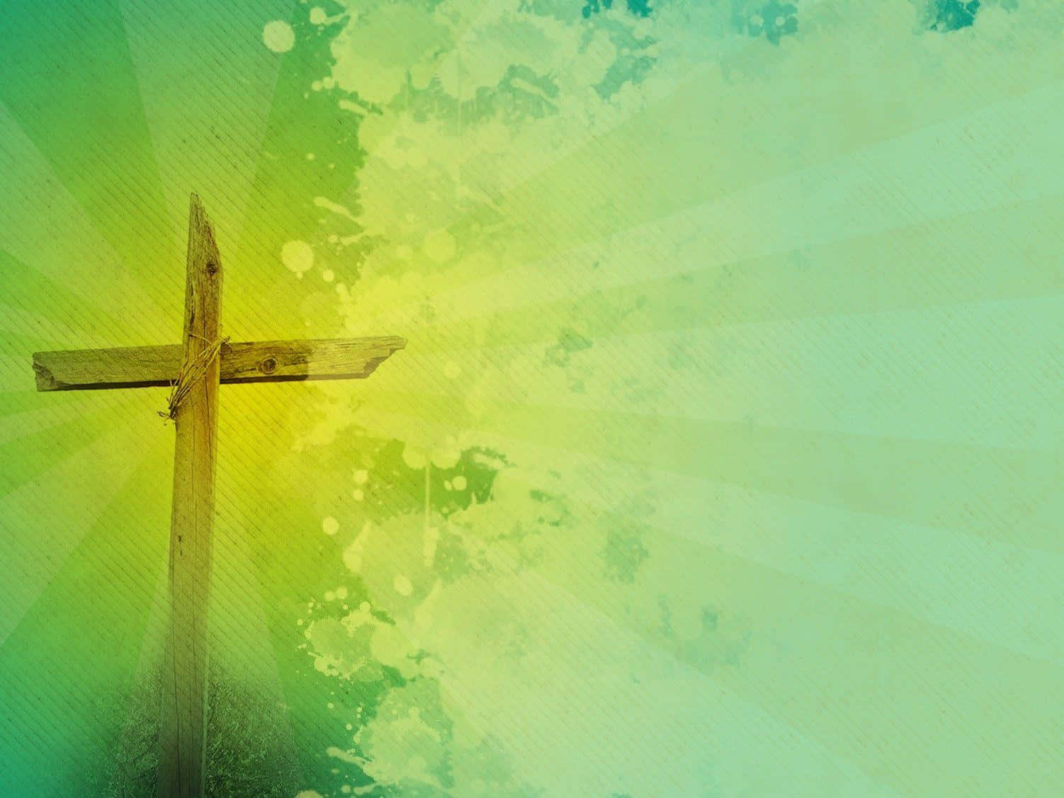 Powerpoint Worship 桌布 壁紙 — 一個風化的木製十字架，矗立在帶有陽光射線和油漆飛濺的鮮豔綠色和黃色紋理背景前。