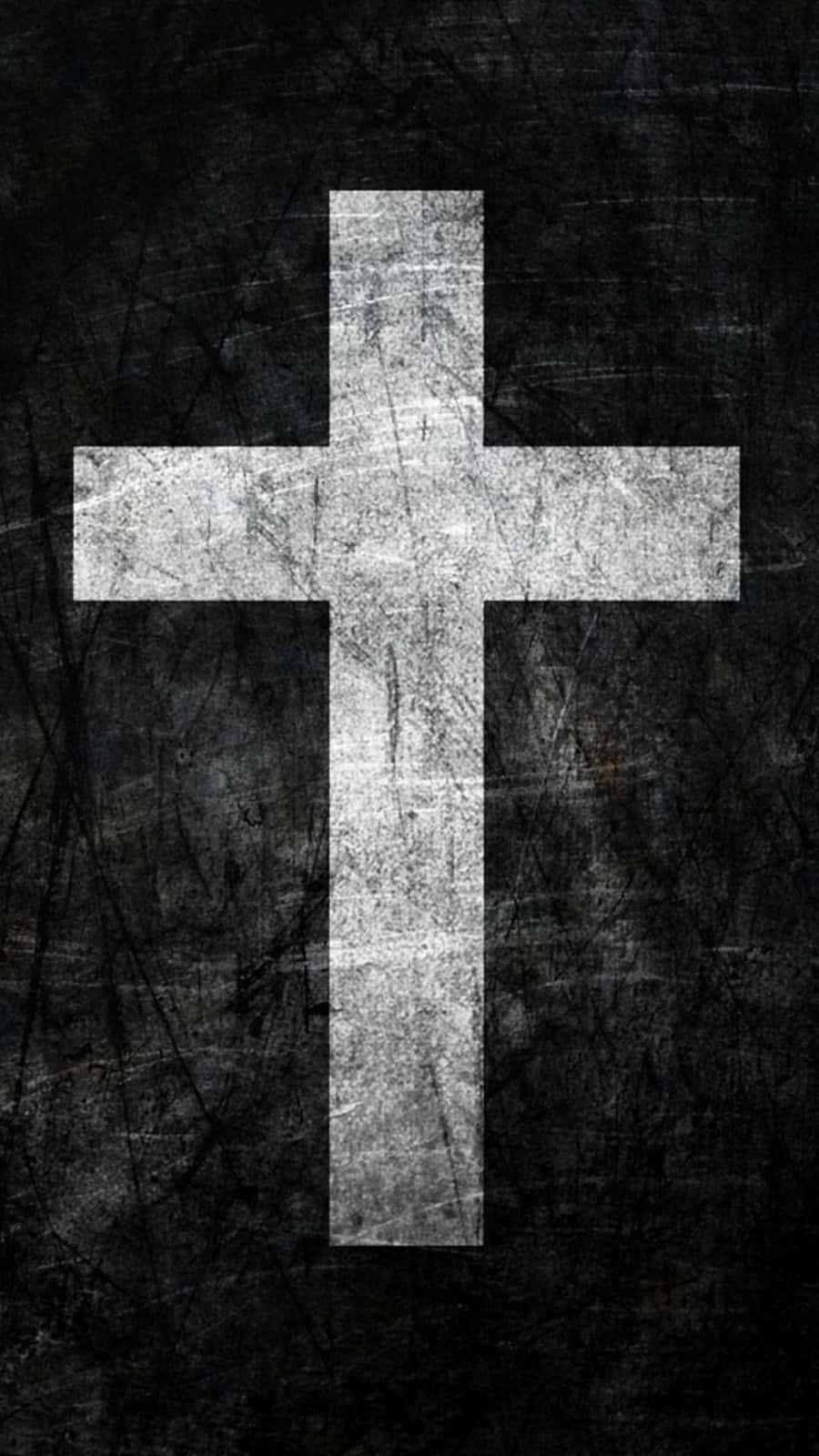 Beautiful Cross 桌布 壁紙 — 一個風化的白色十字架在帶有刮痕和污垢的紋理深色背景上顯得格外突出。