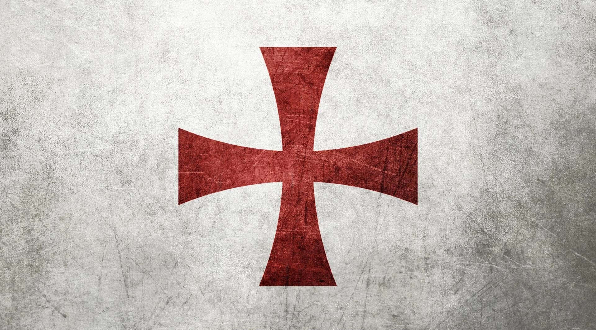 Crusader 桌布 壁紙 — 一個風化的紅色十字標誌居中於有紋理的灰色混凝土表面，帶有可見的刮痕和污漬。