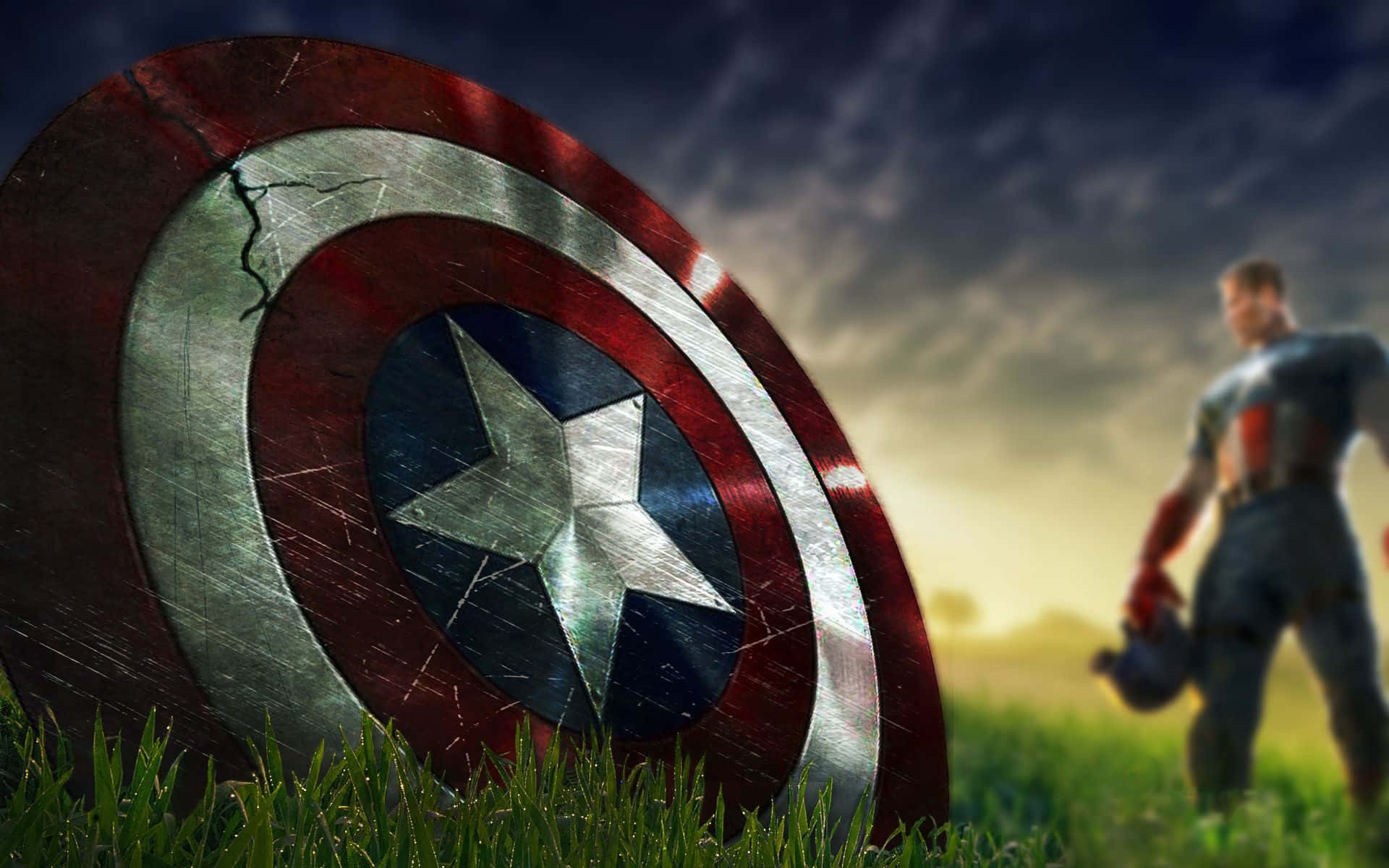 Best Captain America 桌布 壁紙 — 一個風化的美國隊長盾牌躺在草地上，一個模糊的身影站在夕陽背景中。