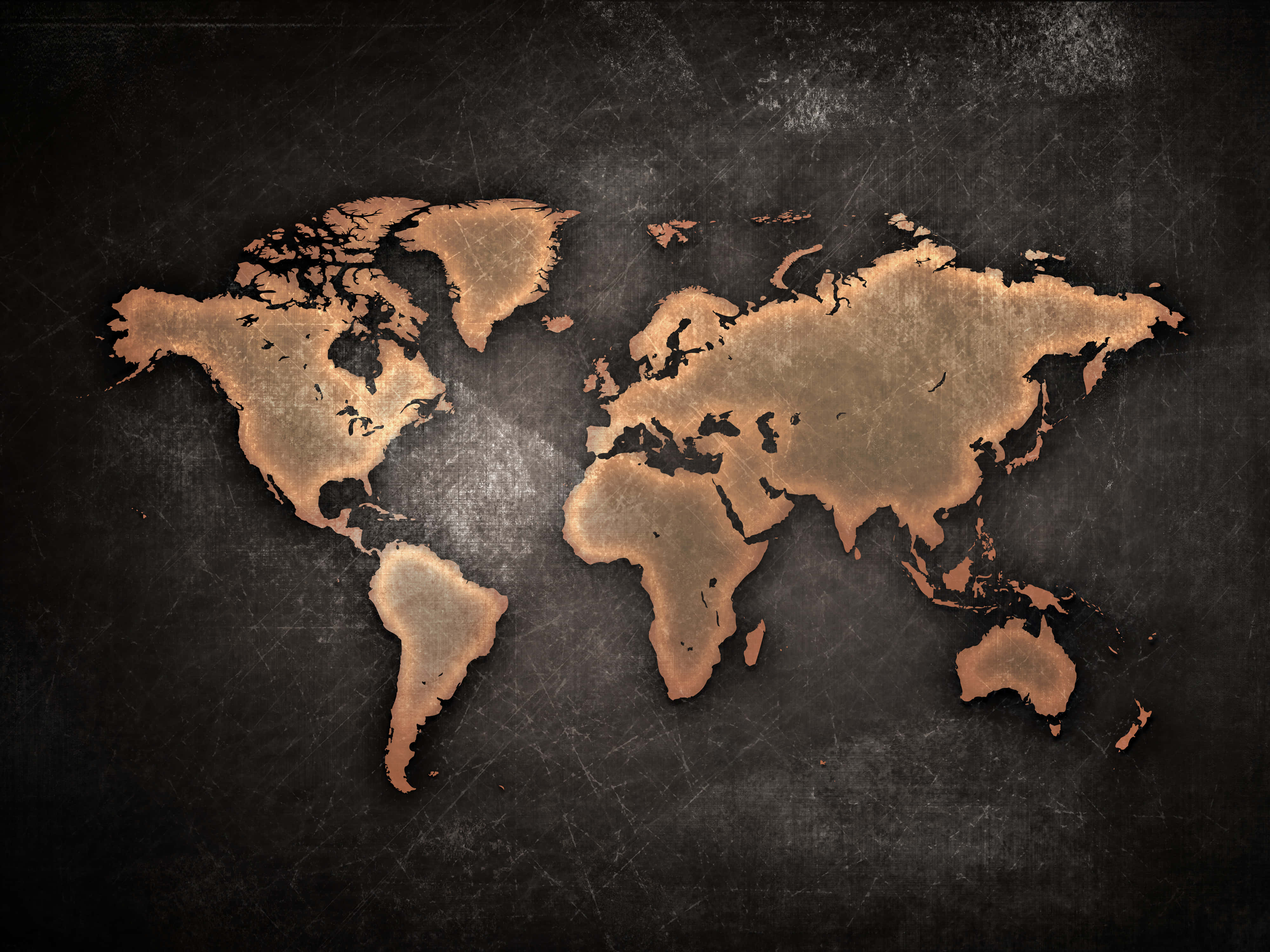 World Map Aesthetic 桌布 壁紙 — 一個風化的銅質世界地圖蝕刻在深色紋理表面上，帶有可見的刮痕和銅綠。