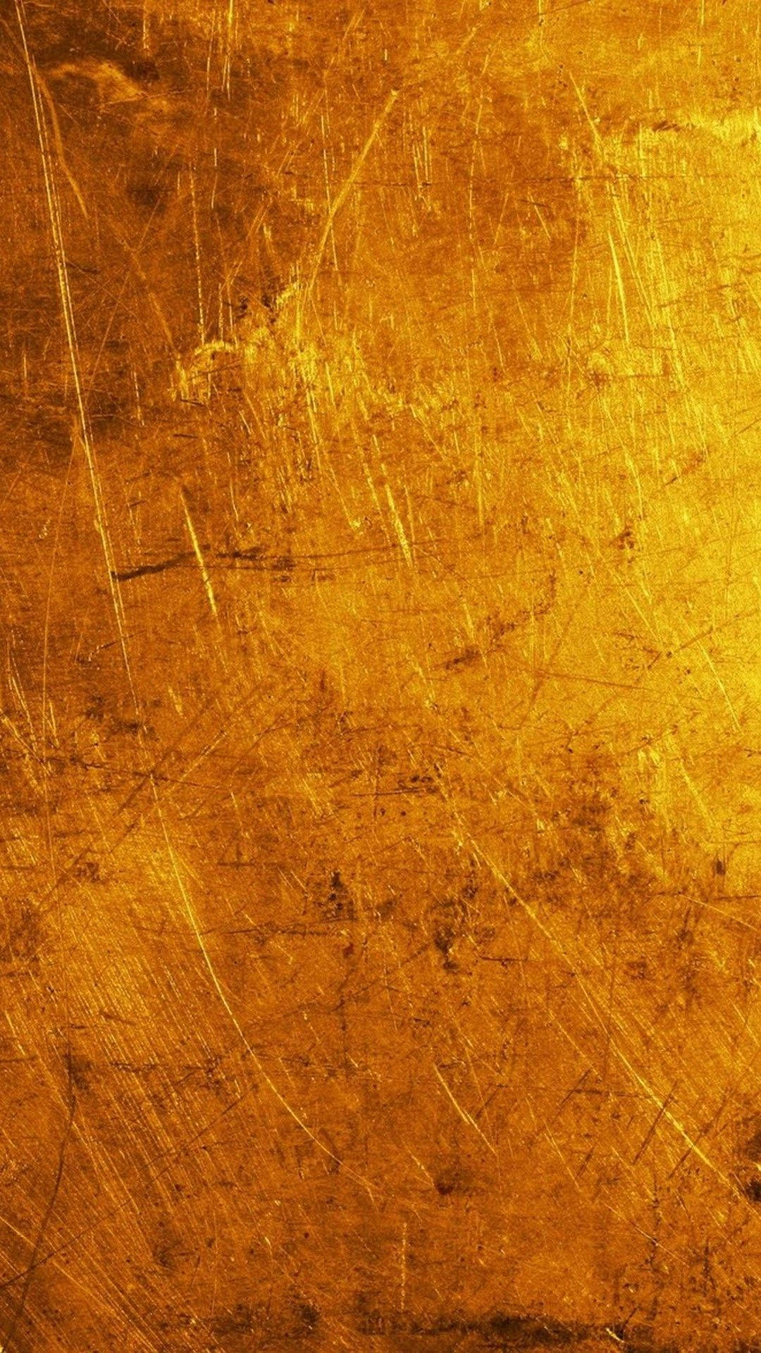 金色美學 桌布 壁紙 — 一個風化金色表面的特寫，帶有刮痕和紋理。