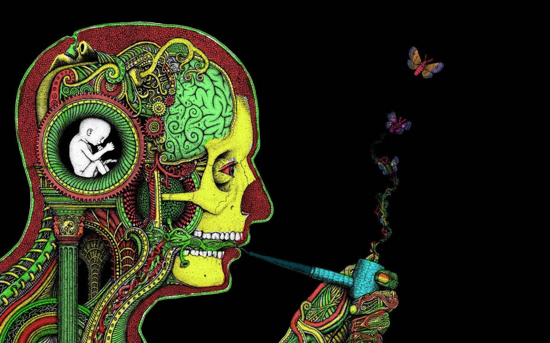 生病 桌布 壁紙 — 一個風格化的人類側面頭像，帶有複雜的綠色、黃色和紅色圖案，揭示齒輪內的胎兒和煙霧形成的蝴蝶，背景為黑色。