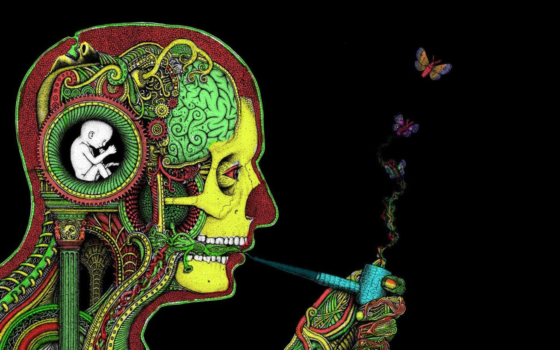桌布 壁紙 — 一個風格化的人類側面頭像，帶有複雜的綠色、黃色和紅色圖案，揭示了齒輪內的胎兒和煙霧形成的蝴蝶，背景為黑色。