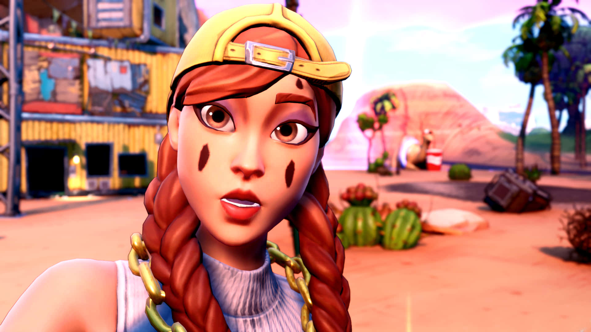Fortnite 桌布 壁紙 — 一個風格化的動漫女孩，辮子頭髮和黃色帽子，站在一個有仙人掌和棕櫚樹的沙漠小鎮，天空是粉紅色的。