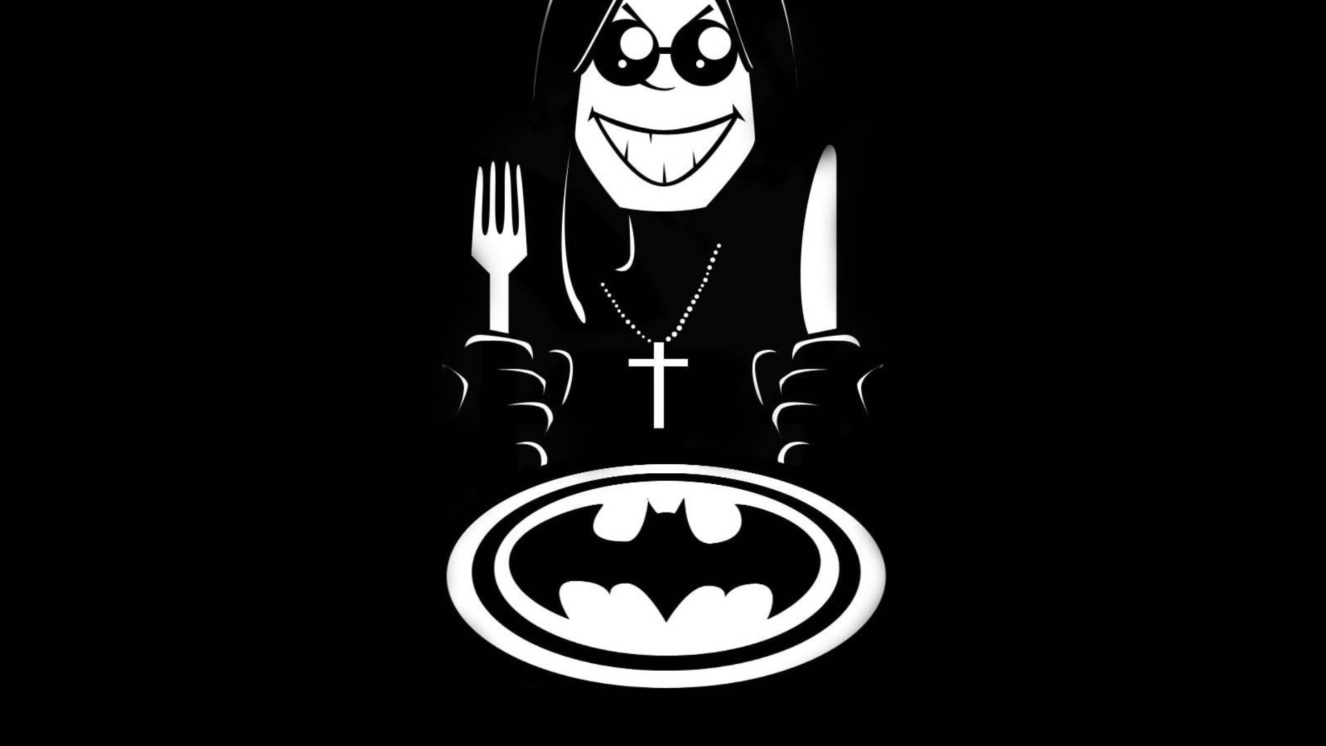Ozzy Osbourne 桌布 壁紙 — 一個風格化的卡通人物，長髮戴太陽眼鏡，在黑色背景上拿著叉子和刀子放在蝙蝠俠標誌的盤子上。