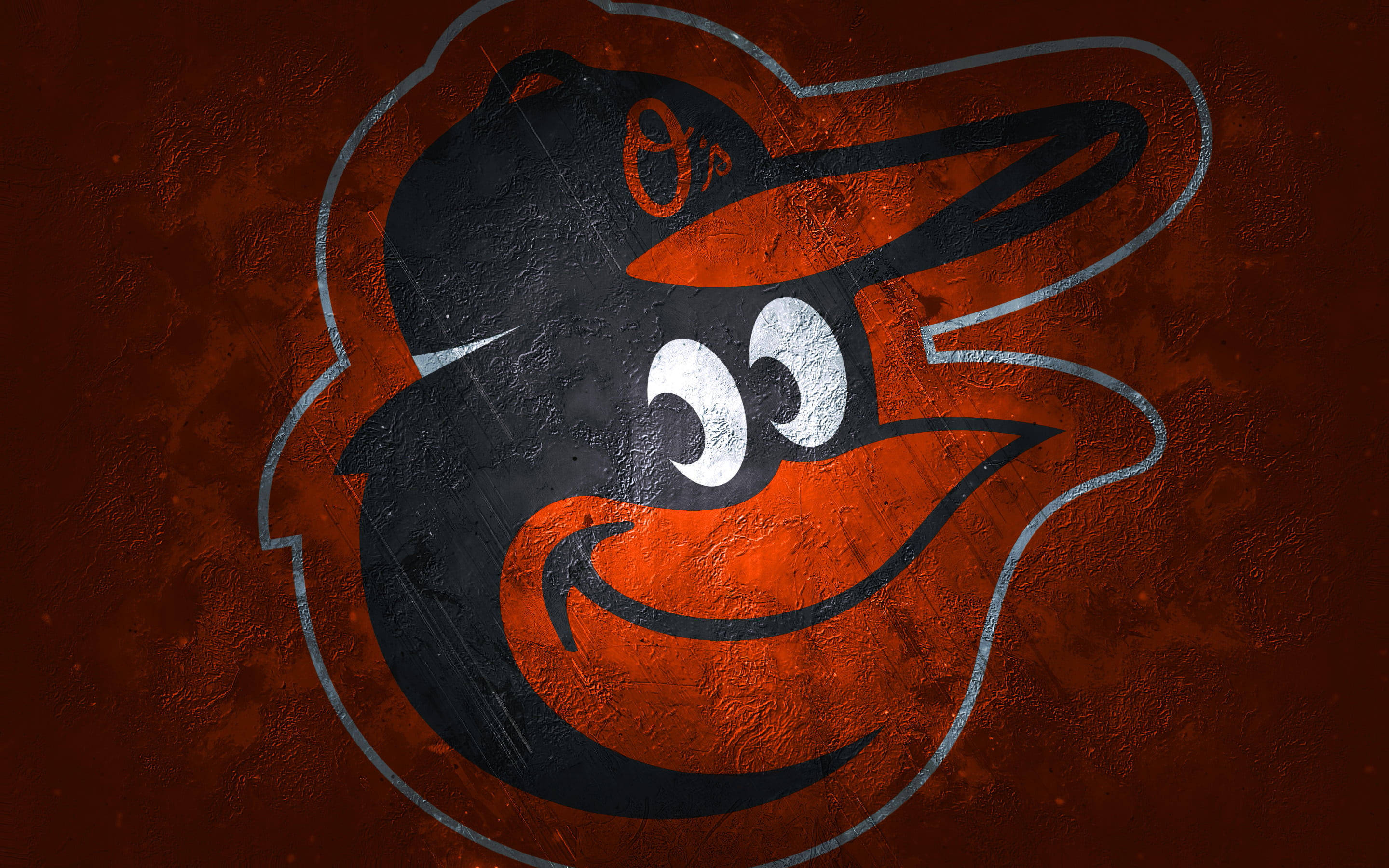 Orioles 桌布 壁紙 — 一個風格化的巴爾的摩金鶯鳥吉祥物標誌，以橙色和黑色繪製在帶有紋理的鏽色牆壁上。