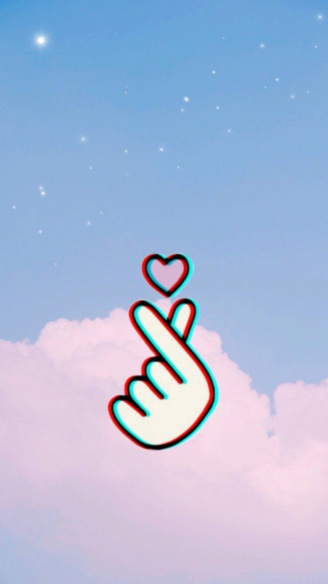 Clouds Aesthetics 桌布 壁紙 — 一個風格化的手勢，上方有一顆心，漂浮在帶有星星和雲朵的粉彩天空上。