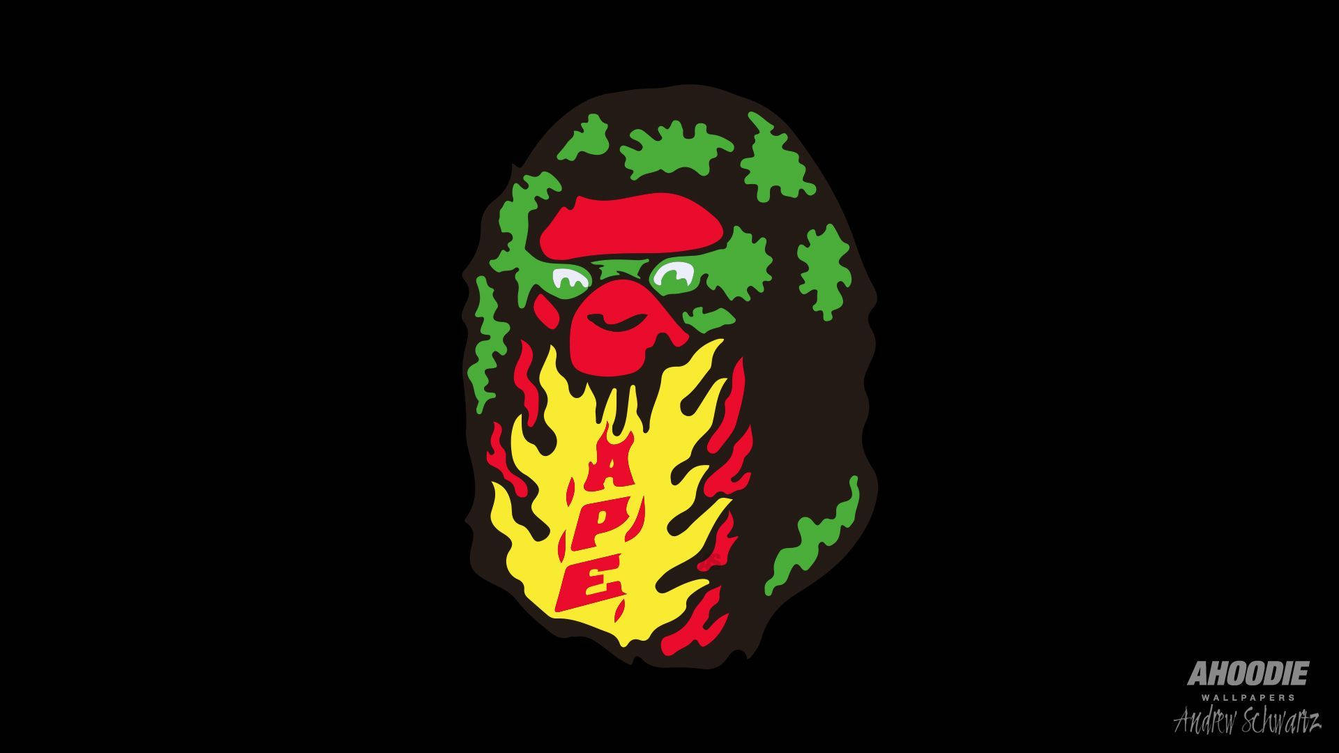 Bape 動態 桌布 壁紙 — 一個風格化的猿頭標誌，帶有綠色迷彩頭髮、紅色太陽眼鏡和黃色火焰鬍鬚，背景為黑色。