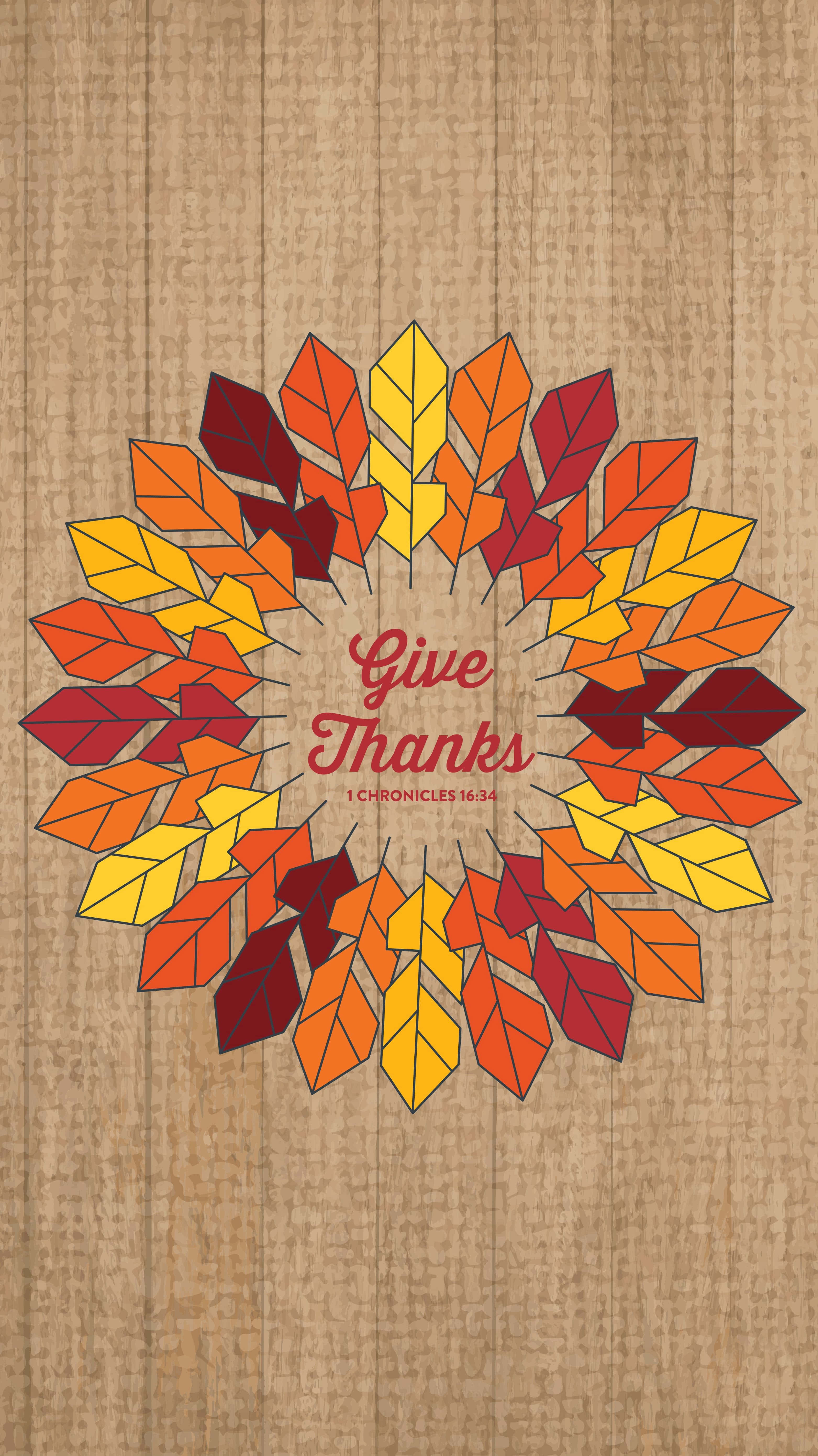 Thanksgiving Phone 桌布 壁紙 — 一個風格化的秋葉花環，以溫暖的紅色、橙色和黃色為主色調，置於有紋理的粗麻布背景中央，並帶有 Give Thanks 字樣。