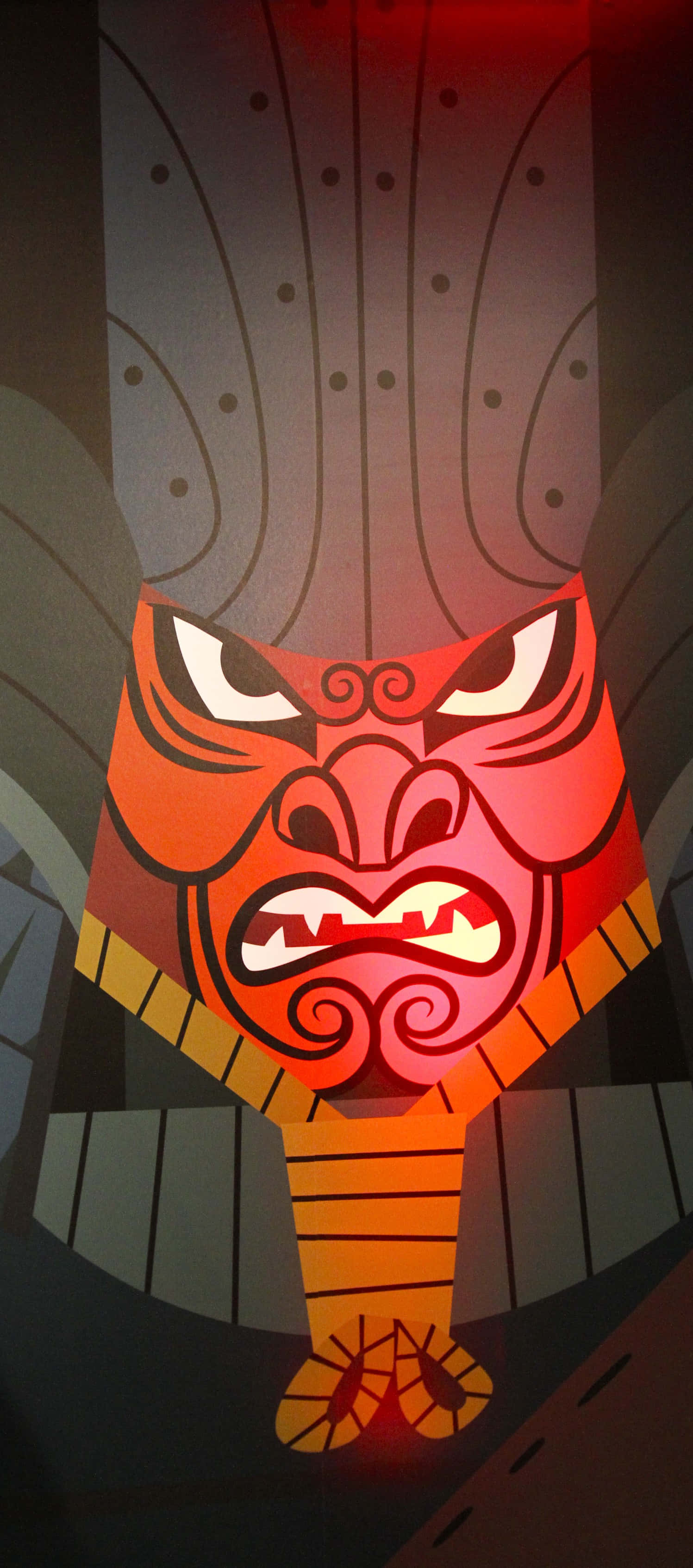 samurai jack 桌布 壁紙 — 一個風格化的紅橙色部落面具，帶有兇猛的眼睛、裸露的牙齒和複雜的圖案，在黑暗背景下發光。