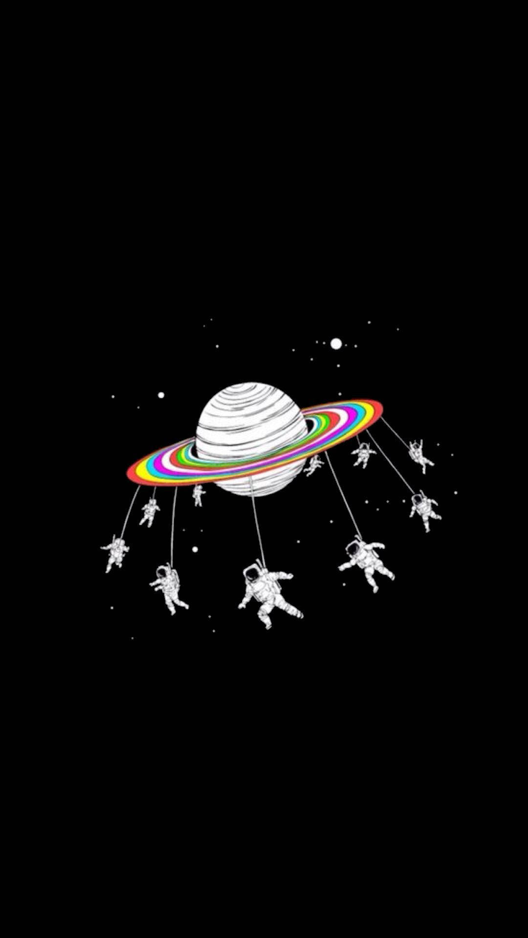 土星 桌布 壁紙 — 一個風格化的行星帶有彩虹環，太空人懸掛在繩索上，背景是繁星點點的黑色虛空。