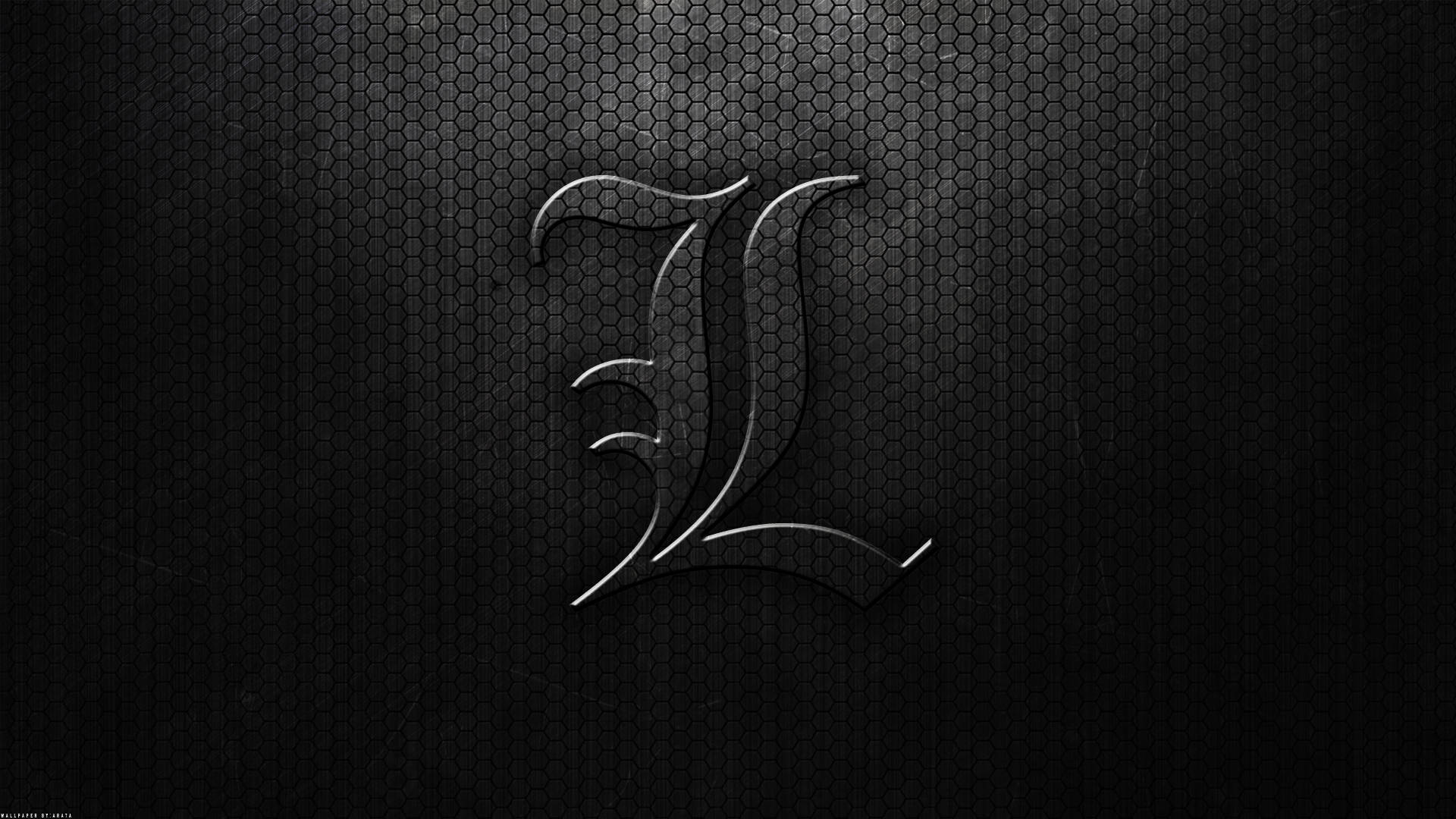 L 桌布 壁紙 — 一個風格化的金屬字母L在深色六角網格背景上閃耀，帶有微妙的燈光。