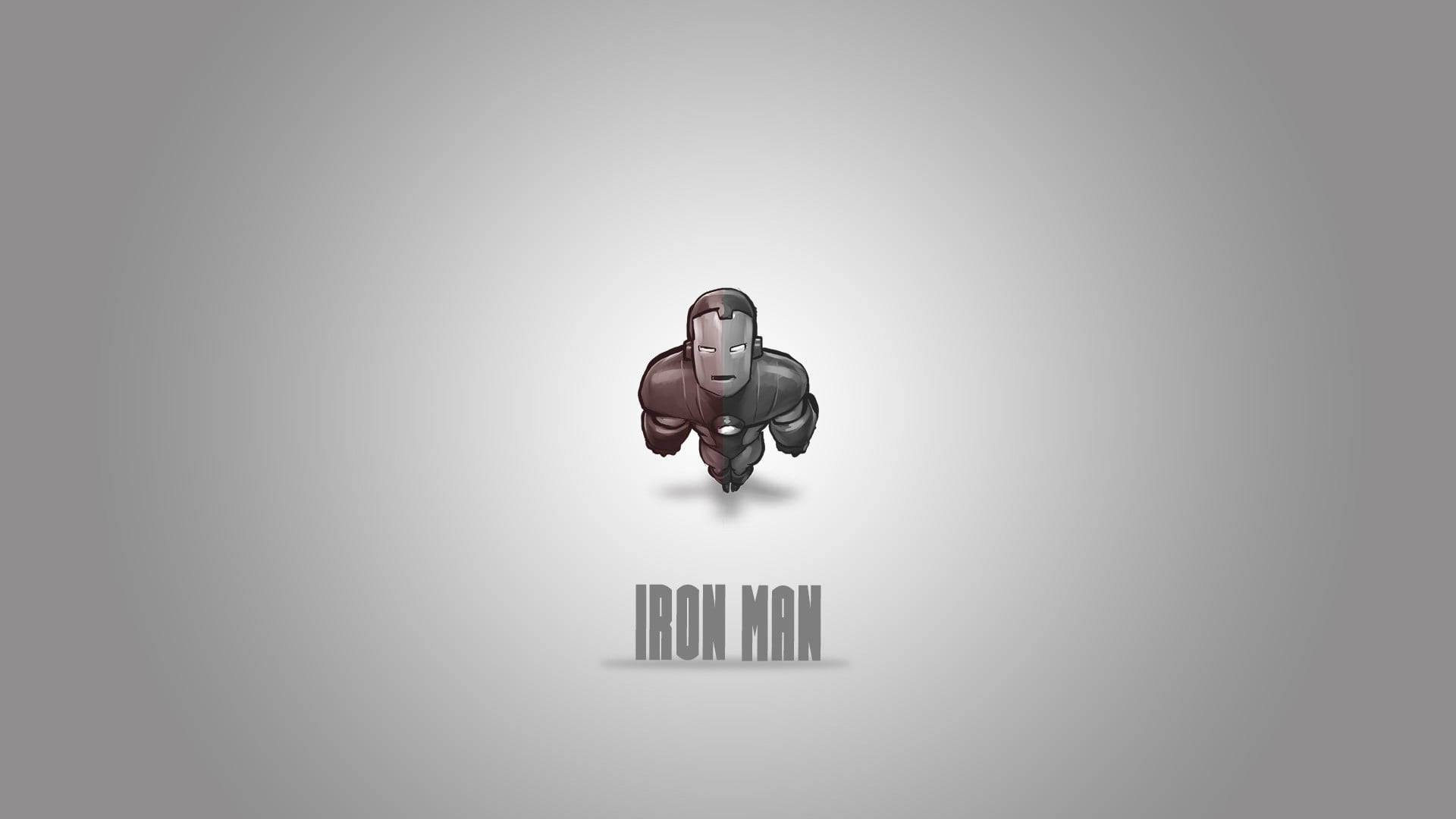 Iron Man Logo 桌布 壁紙 — 一個風格化的鋼鐵人人物穿著極簡金屬戰衣，漂浮在漸變灰色背景上，下方有「IRON MAN」文字。