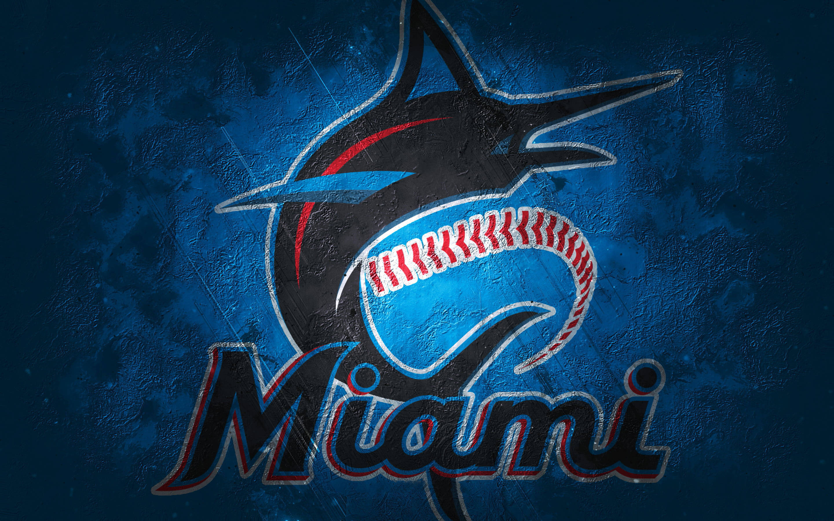 Marlins 桌布 壁紙 — 一個風格化的鯊魚標誌，帶有棒球縫線的嘴巴，置於有紋理的深藍色背景上。