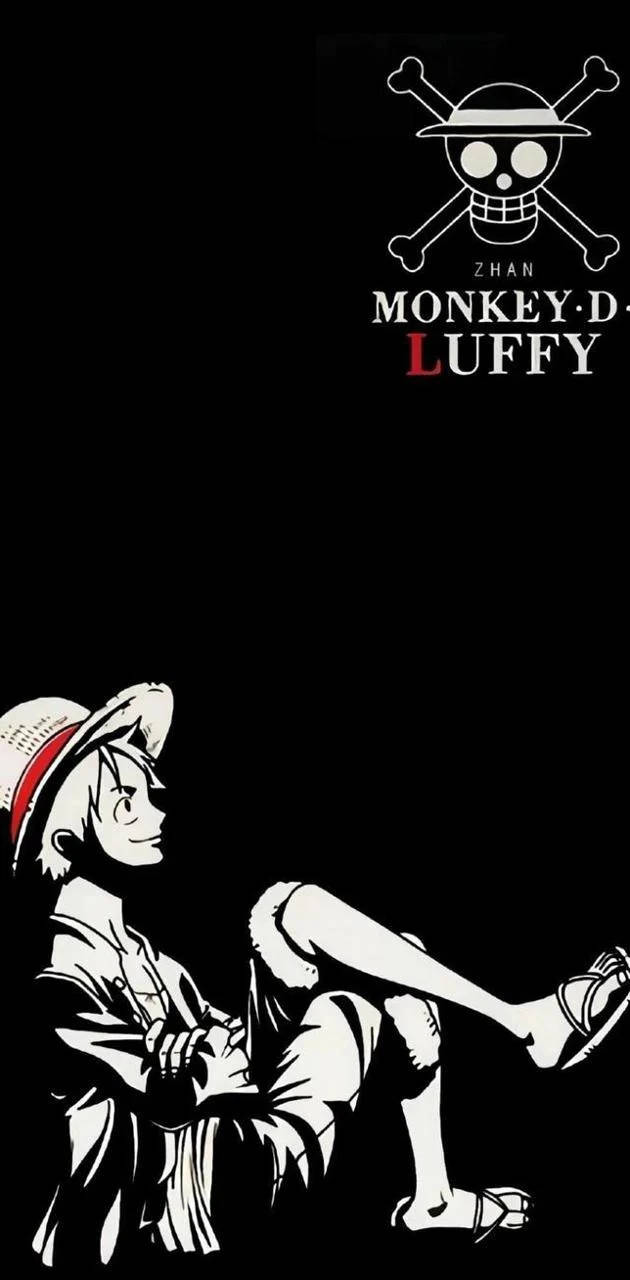 Luffy 桌布 壁紙 — 一個風格化的黑白動漫角色魯夫，在深色背景上隨意坐著，上方有他標誌性的骷髏頭和交叉骨頭的海盜旗標誌。