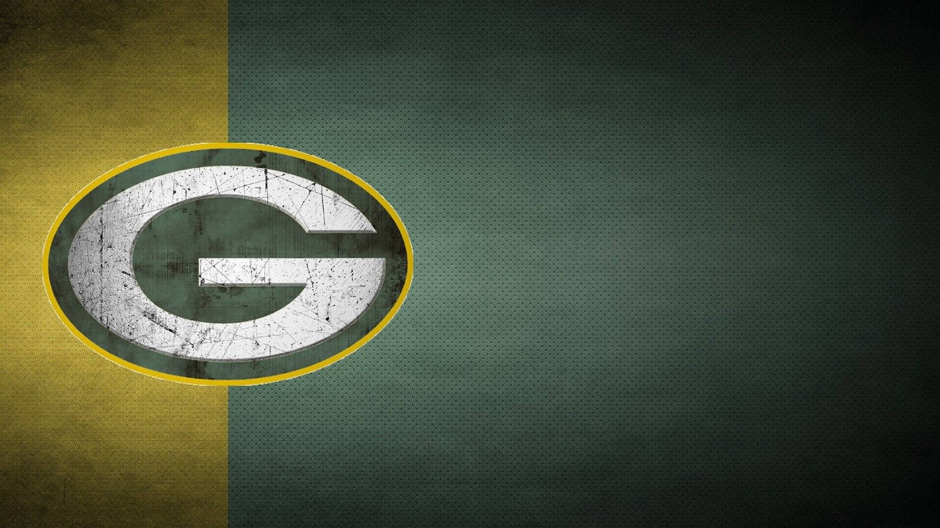 Packers 桌布 壁紙 — 一個飽經風霜的綠灣包裝工標誌，在分裂的綠色和金色紋理背景上有一個磨損的白色G。