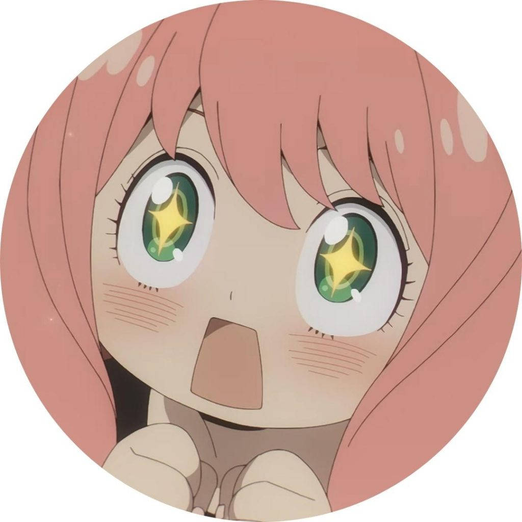 Anya Forger 桌布 壁紙 — 一個驚訝的動漫女孩，粉紅色頭髮和閃閃發光的綠色眼睛，在圓形框架中睜大眼睛凝視。
