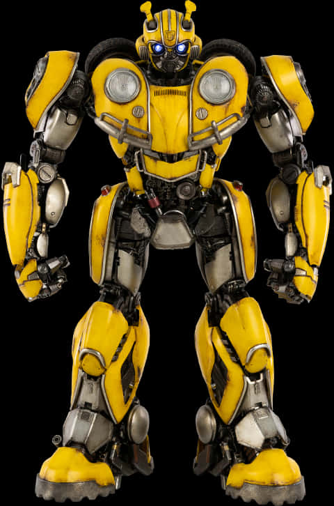 Bumblebee 桌布 壁紙 — 一個高大的黃黑機器人，發著藍光的眼睛，以英雄姿態站在純黑背景前。