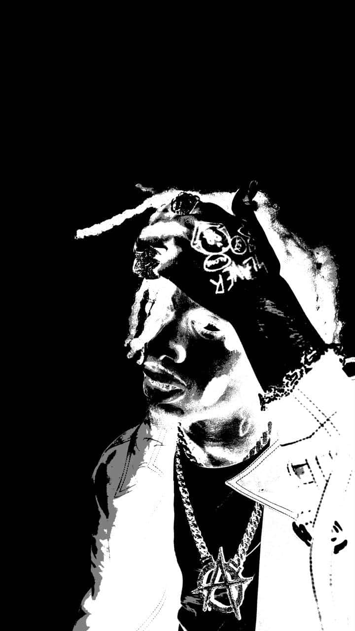 Die Lit 桌布 壁紙 — 一個高對比度的黑白風格化肖像，描繪一名戴著頭巾和辮子的男子，背景為深色。
