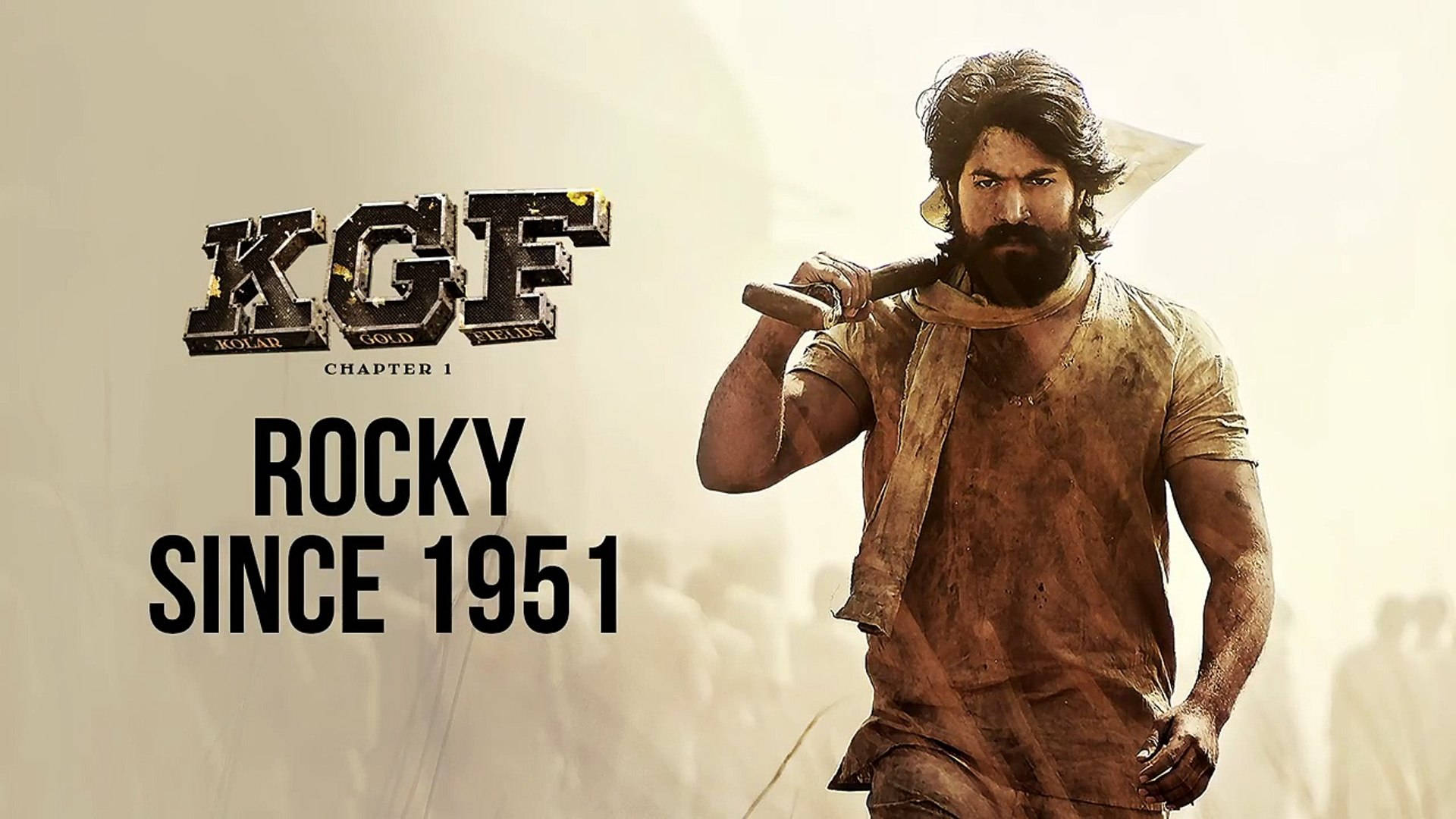 rocky 桌布 壁紙 — 一個鬍鬚、衣衫襤褸的粗獷堅毅男人，肩上扛著一把錘子，背景朦朧，帶有粗體電影標題文字。