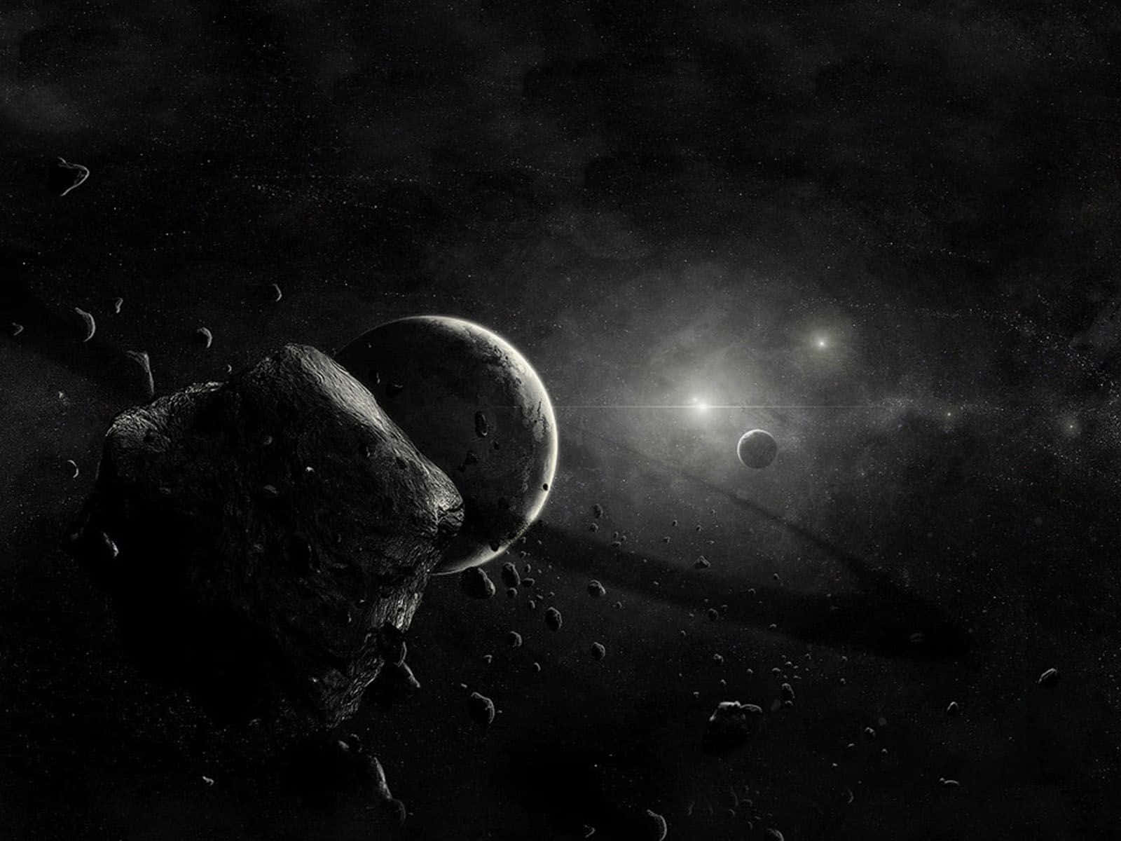 Black Space 桌布 壁紙 — 一個鮮明的單色宇宙場景，包含一顆大型小行星和行星，遠處的星星以及較小的天體漂浮在深空中。