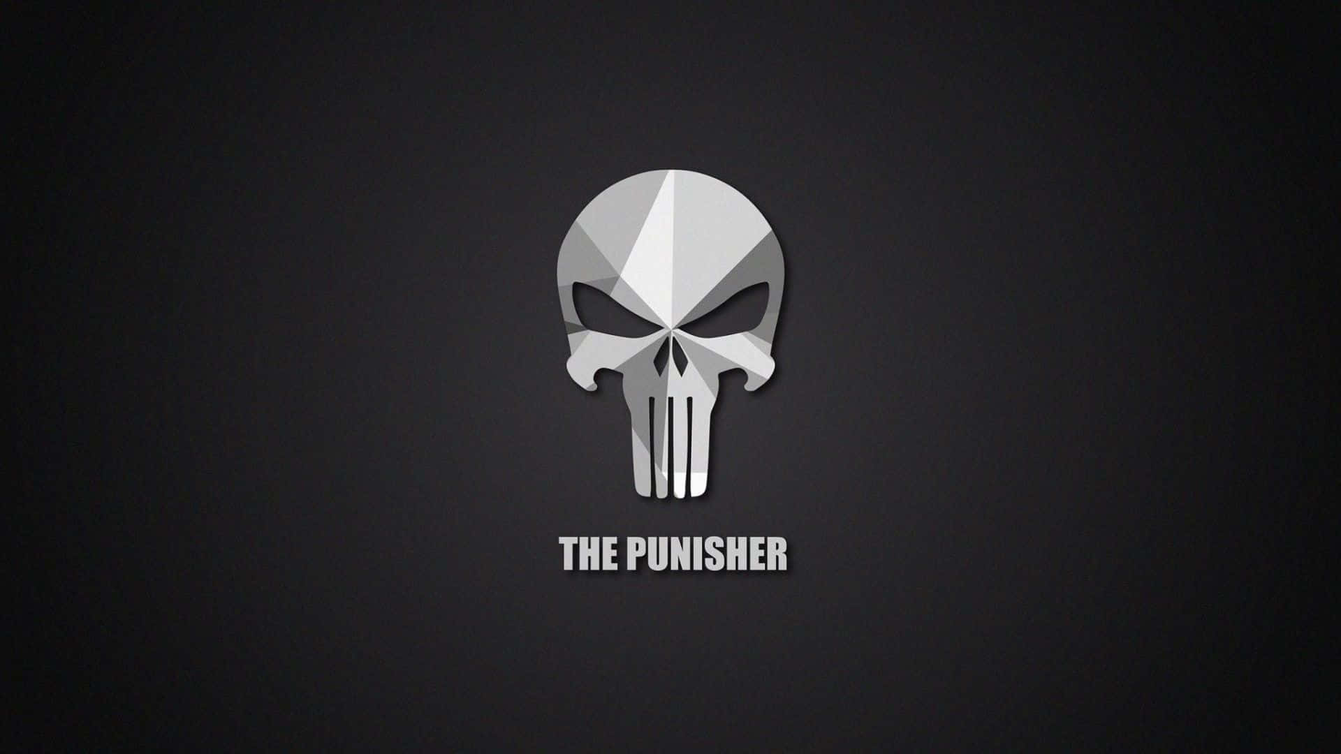 Punisher Desktop 桌布 壁紙 — 一個鮮明的幾何骷髏標誌，帶有銳利的銀色切面，居中放置在深灰色背景上，下方有粗體白色文字。