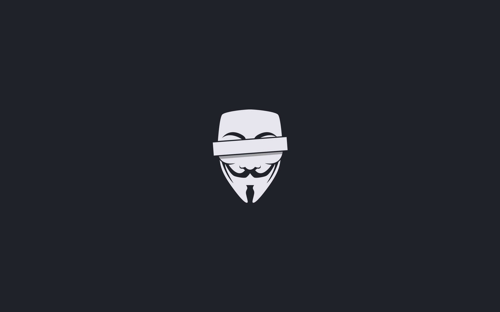 匿名 桌布 壁紙 — 一個鮮明的白色 Guy Fawkes 面具，置於深灰色背景中央，線條簡約乾淨。