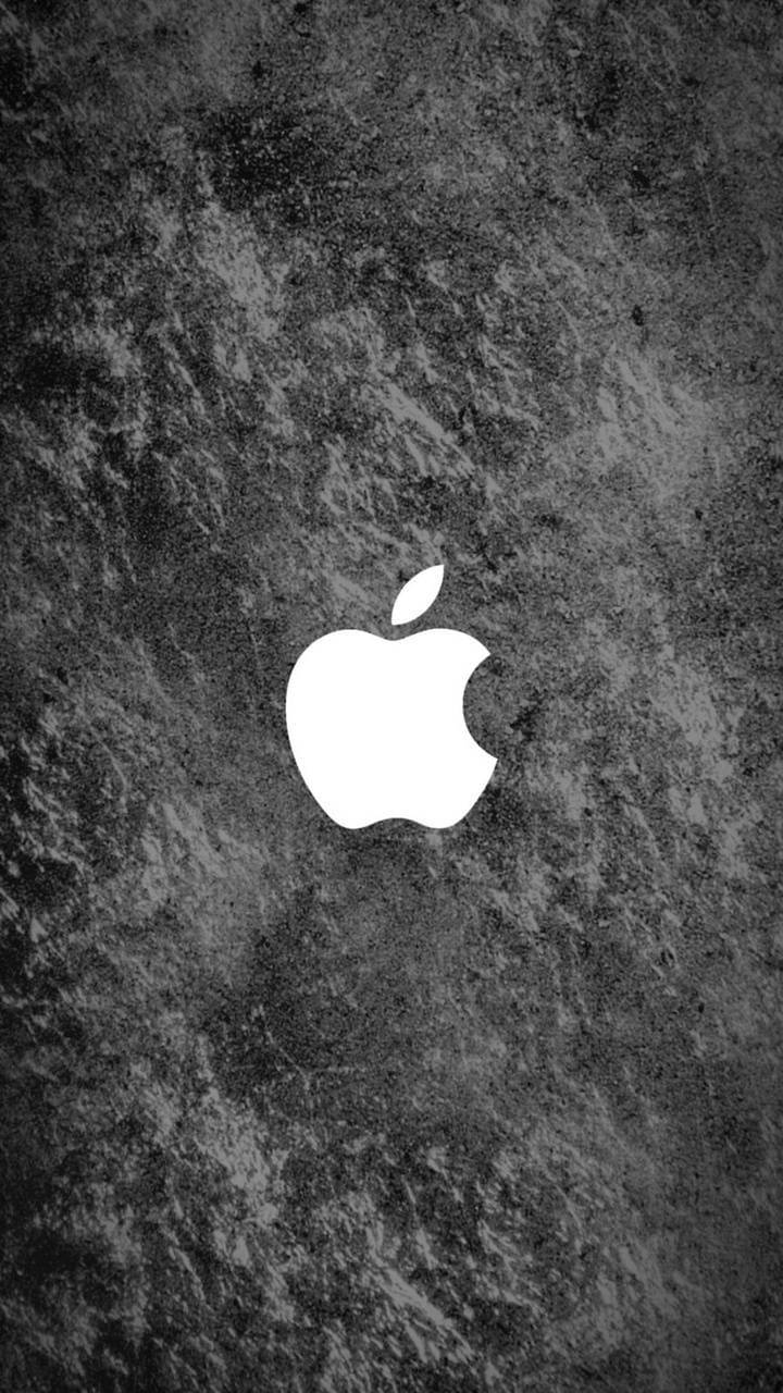 白色Apple標誌在深色有紋理的混凝土背景上。 — 蘋果標誌 GIF 壁紙