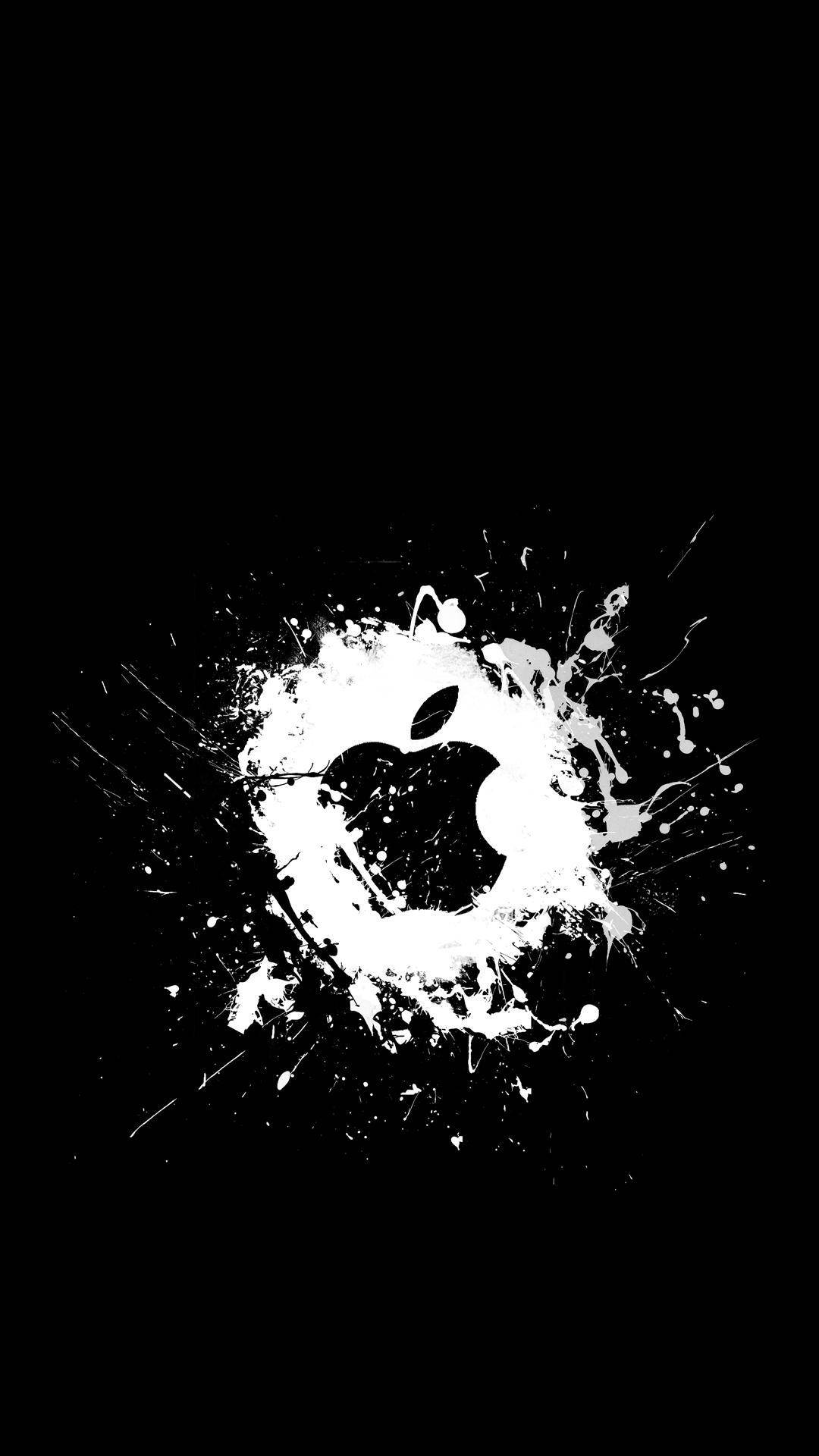  壁紙 — 一個鮮明的白色Apple標誌從純黑色背景上的動態油漆飛濺中浮現。