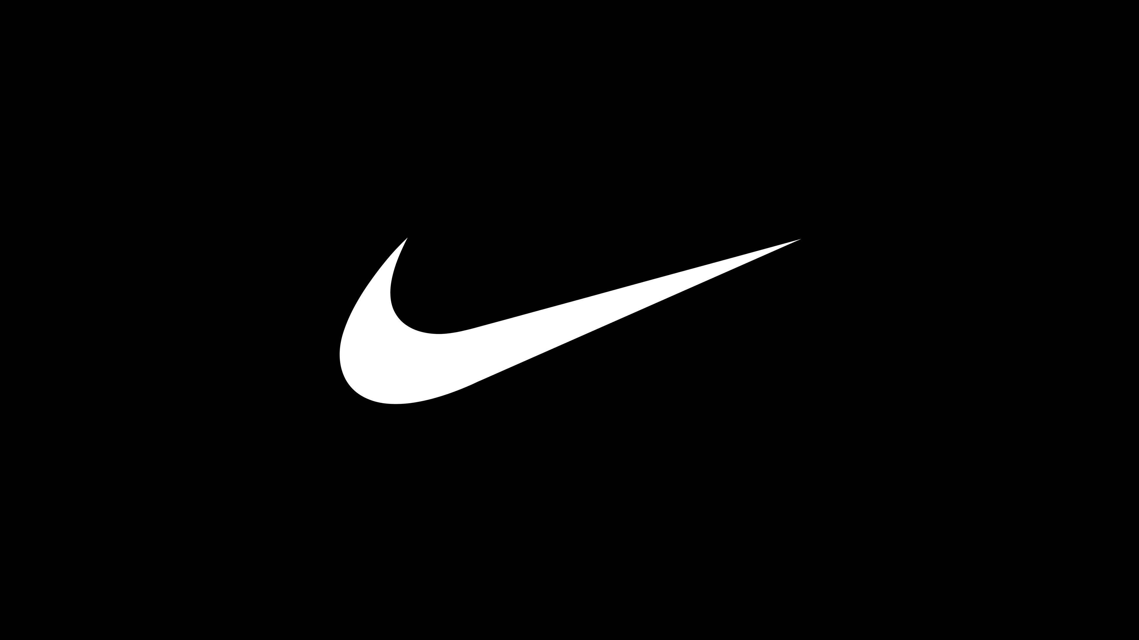 Swoosh 桌布 壁紙 — 一個鮮明的白色Nike Swoosh標誌置於純黑色背景中央。