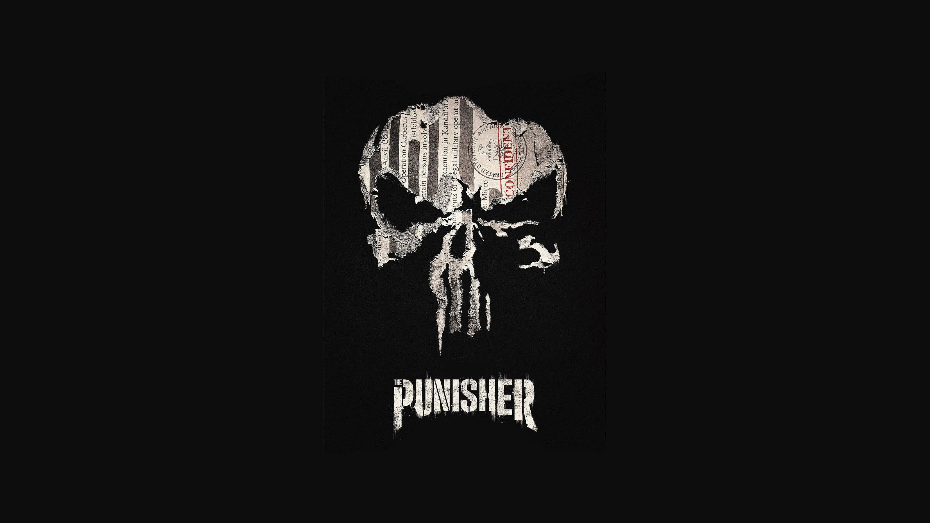 Punisher Logo 桌布 壁紙 — 一個鮮明的白色懲罰者骷髏標誌，內含報紙剪報和印章，置於純黑色背景上。