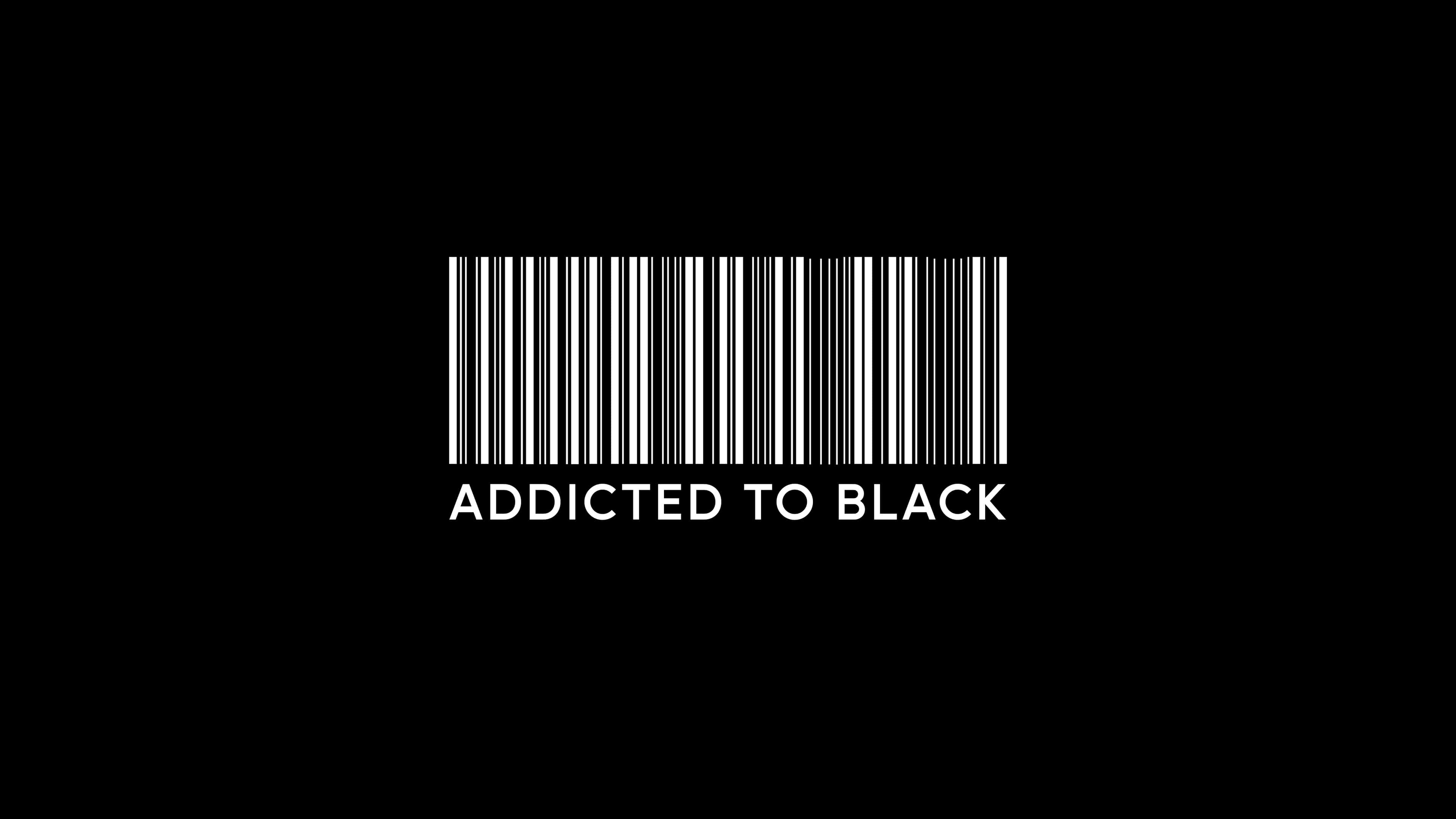 黑白 桌布 壁紙 — 一個鮮明的白色條碼和文字 addicted to black 居中在純黑色背景上。