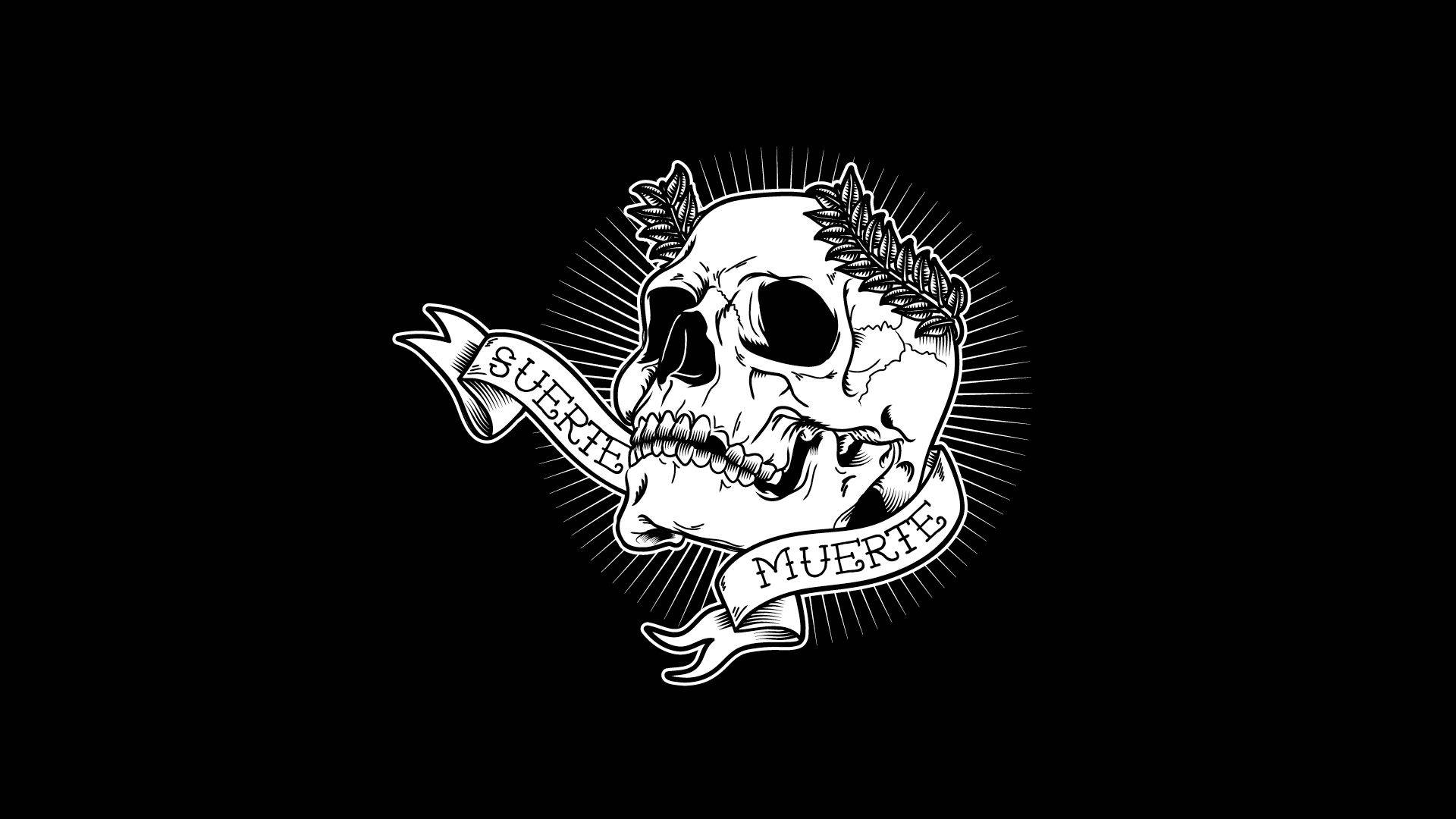 Cute Skeleton 桌布 壁紙 — 一個鮮明的黑白插圖，描繪了一個帶有月桂花環和寫有「SUERTE」和「MUERTE」橫幅的骷髏頭，背景為純黑色。
