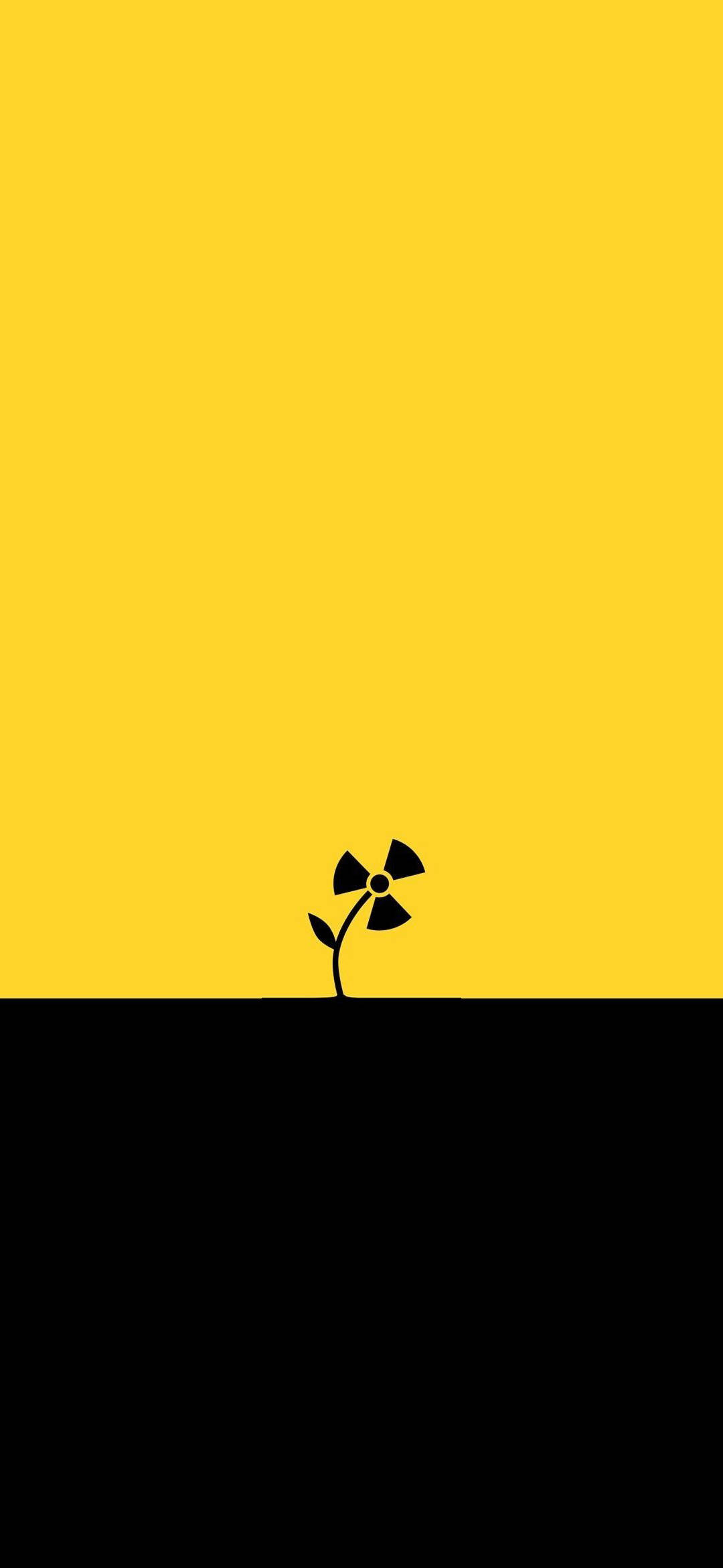 Minimalist Phone 桌布 壁紙 — 一個鮮明的黑色放射性標誌像花朵一樣在由黑色地平線分割的鮮黃色背景上綻放。