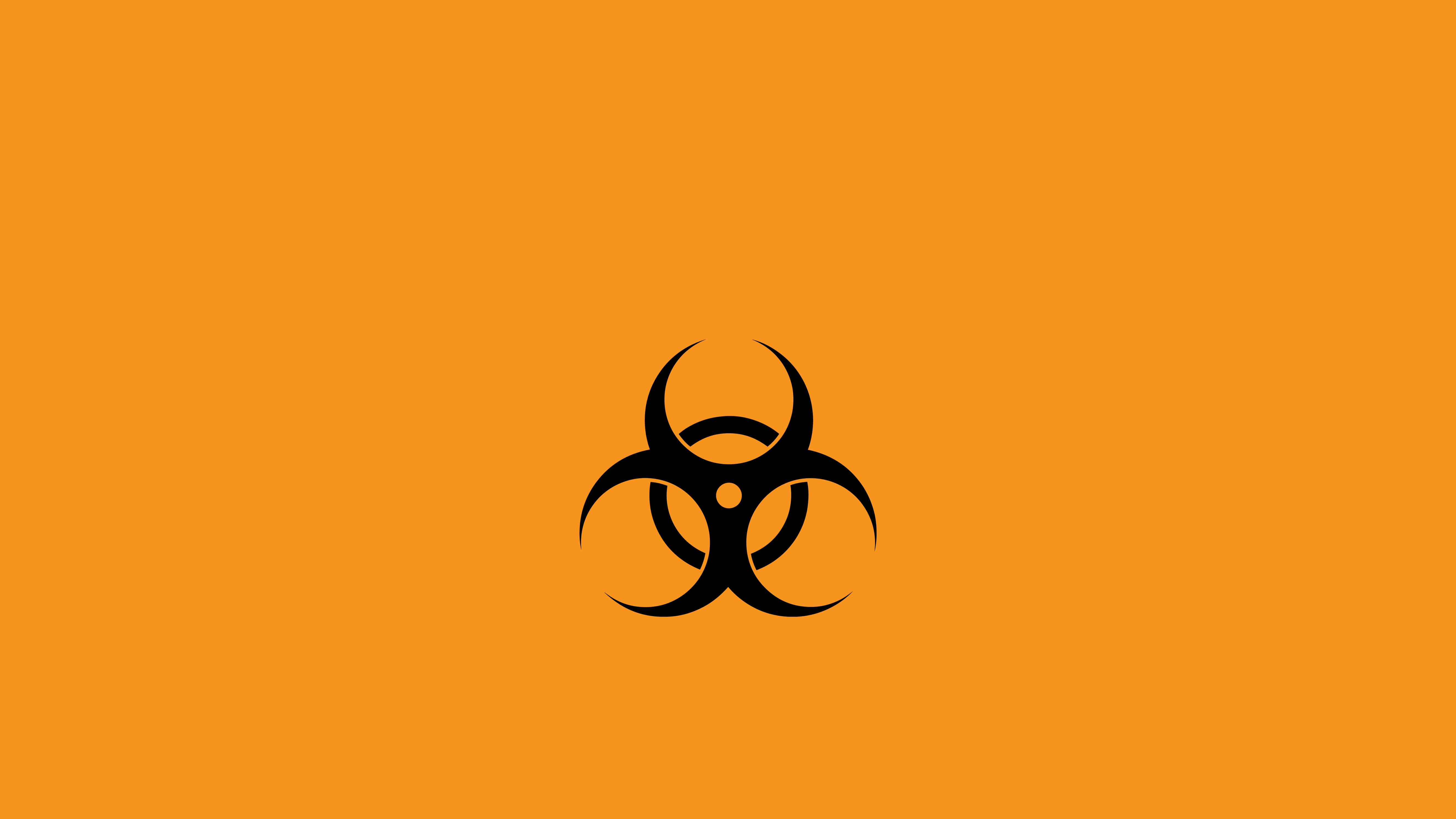 Dangerous 桌布 壁紙 — 一個鮮明的黑色生物危害標誌，置於純橙色背景中央。