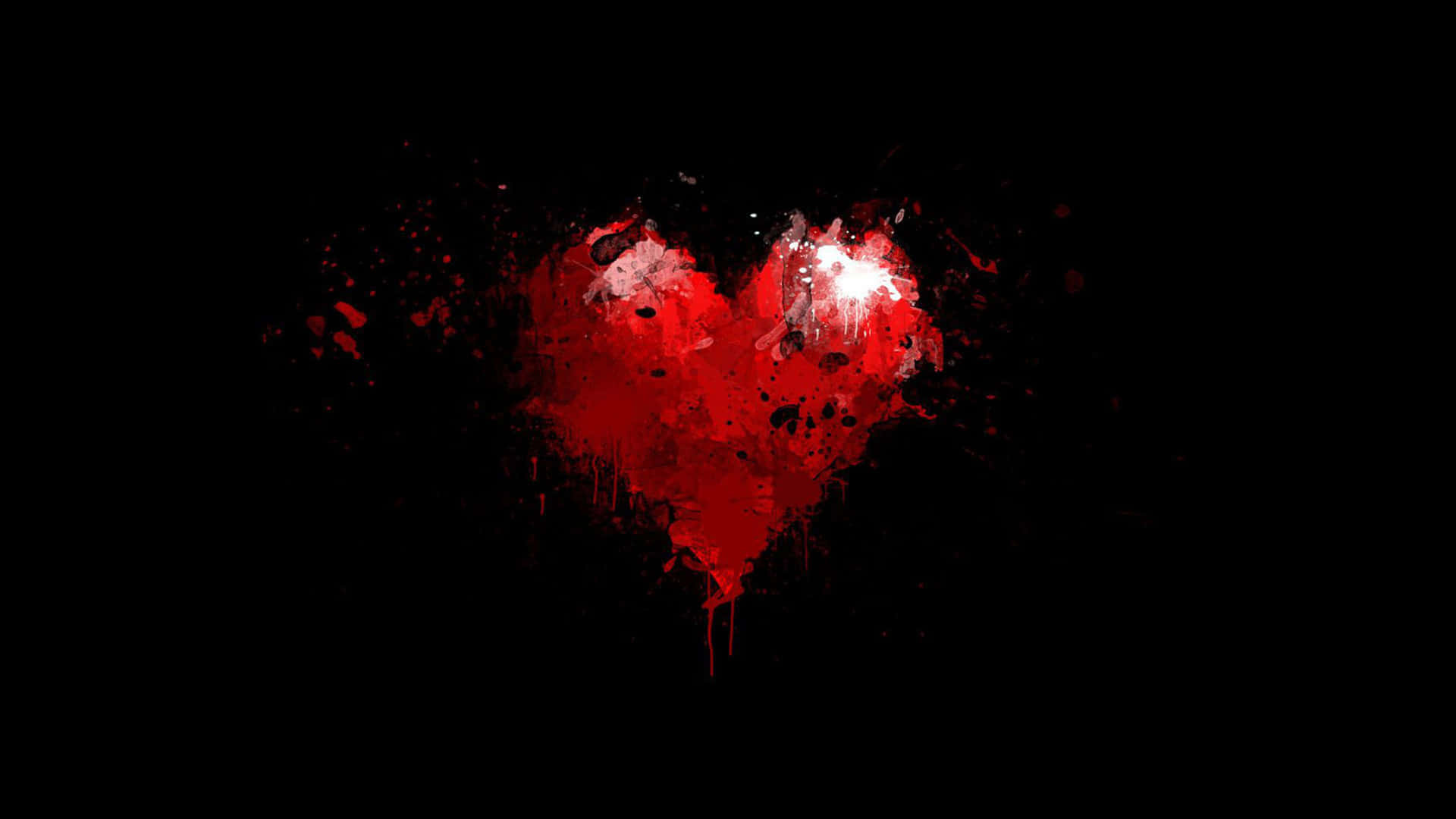Red Heart 桌布 壁紙 — 一個鮮紅色的心臟被油漆濺灑並滴落在純黑背景上。