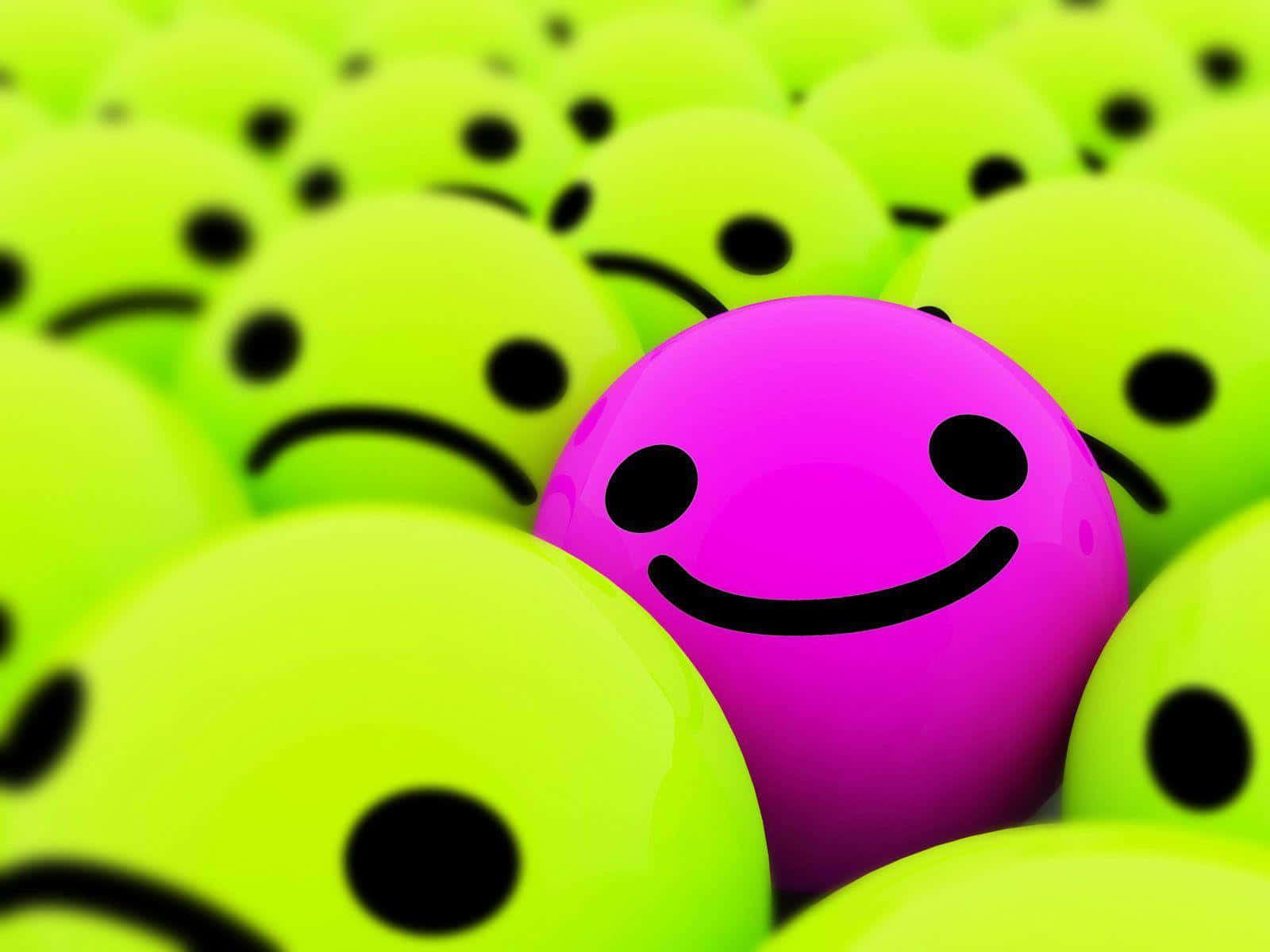 Smile 桌布 壁紙 — 一個鮮豔的粉紅色微笑表情符號在眾多發光的綠色皺眉表情符號中脫穎而出。