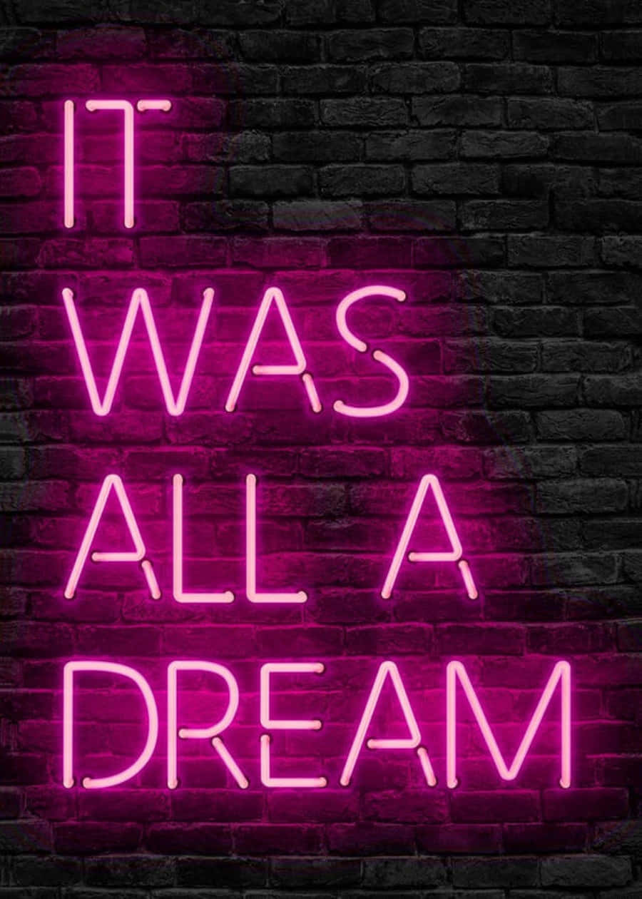 Aesthetic Dark Pink 桌布 壁紙 — 一個鮮豔的粉紅色霓虹燈牌，上面寫著「IT WAS ALL A DREAM」，在深色紋理磚牆上發光。