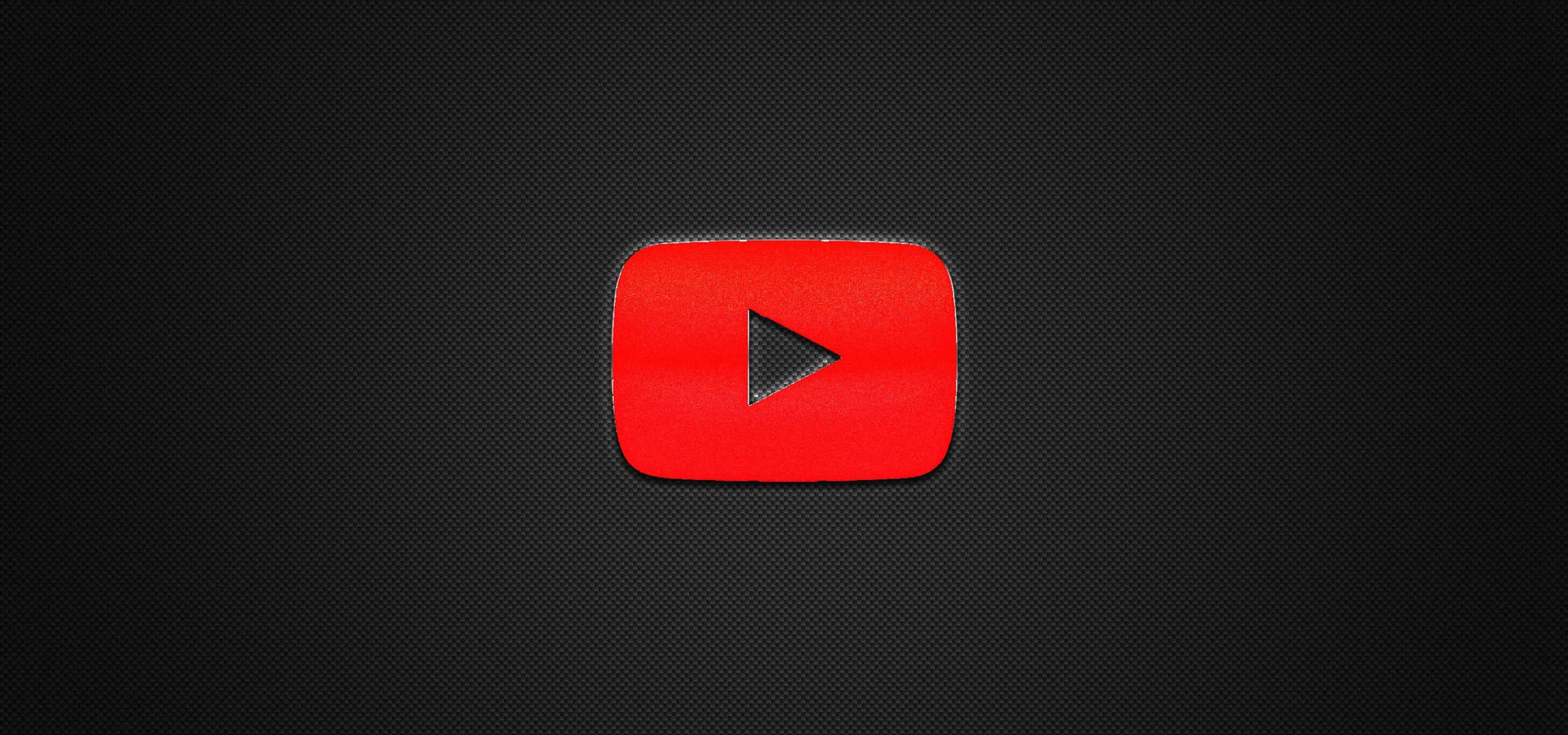 YouTube 標誌 桌布 壁紙 — 一個鮮豔的紅色 YouTube 播放按鈕圖示，居中在深色紋理背景上。