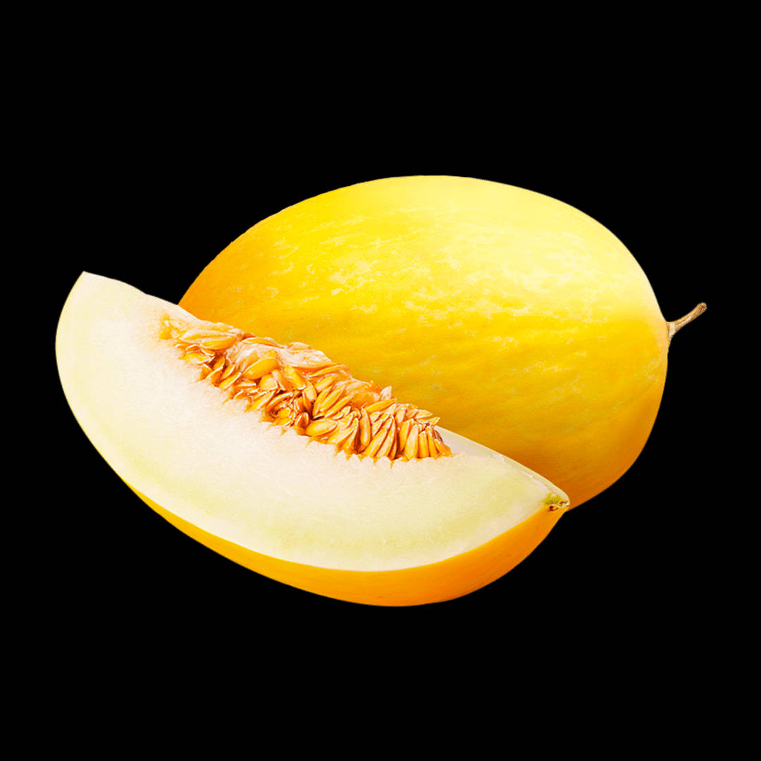 Fruit 桌布 壁紙 — 一個鮮黃色的哈密瓜在純黑背景前被切開，露出多汁的淡色果肉和橙色種子。