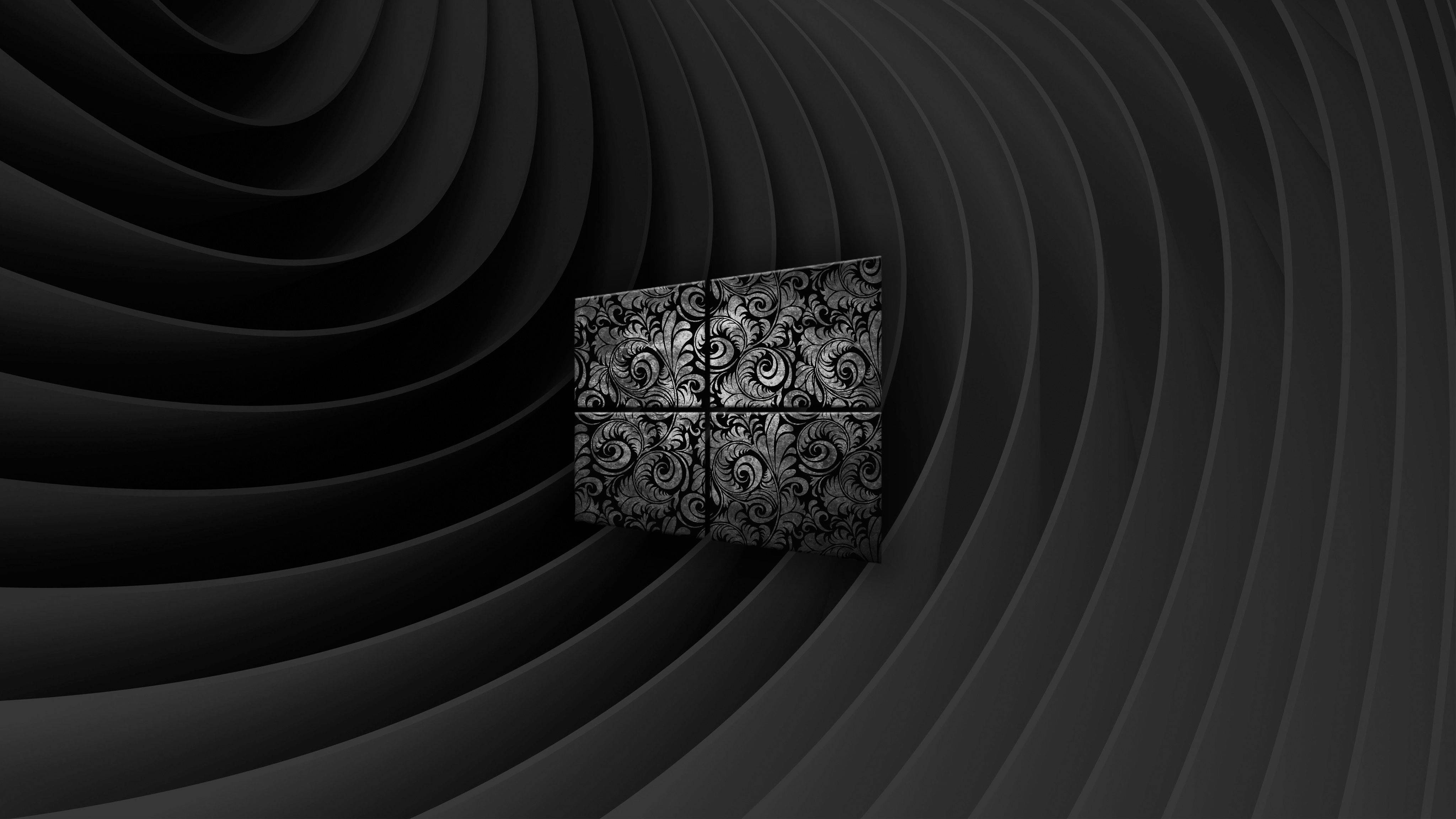 Dark Windows 桌布 壁紙 — 一個黑白Windows標誌帶有華麗的漩渦圖案，漂浮在同心彎曲面板的隧道中。